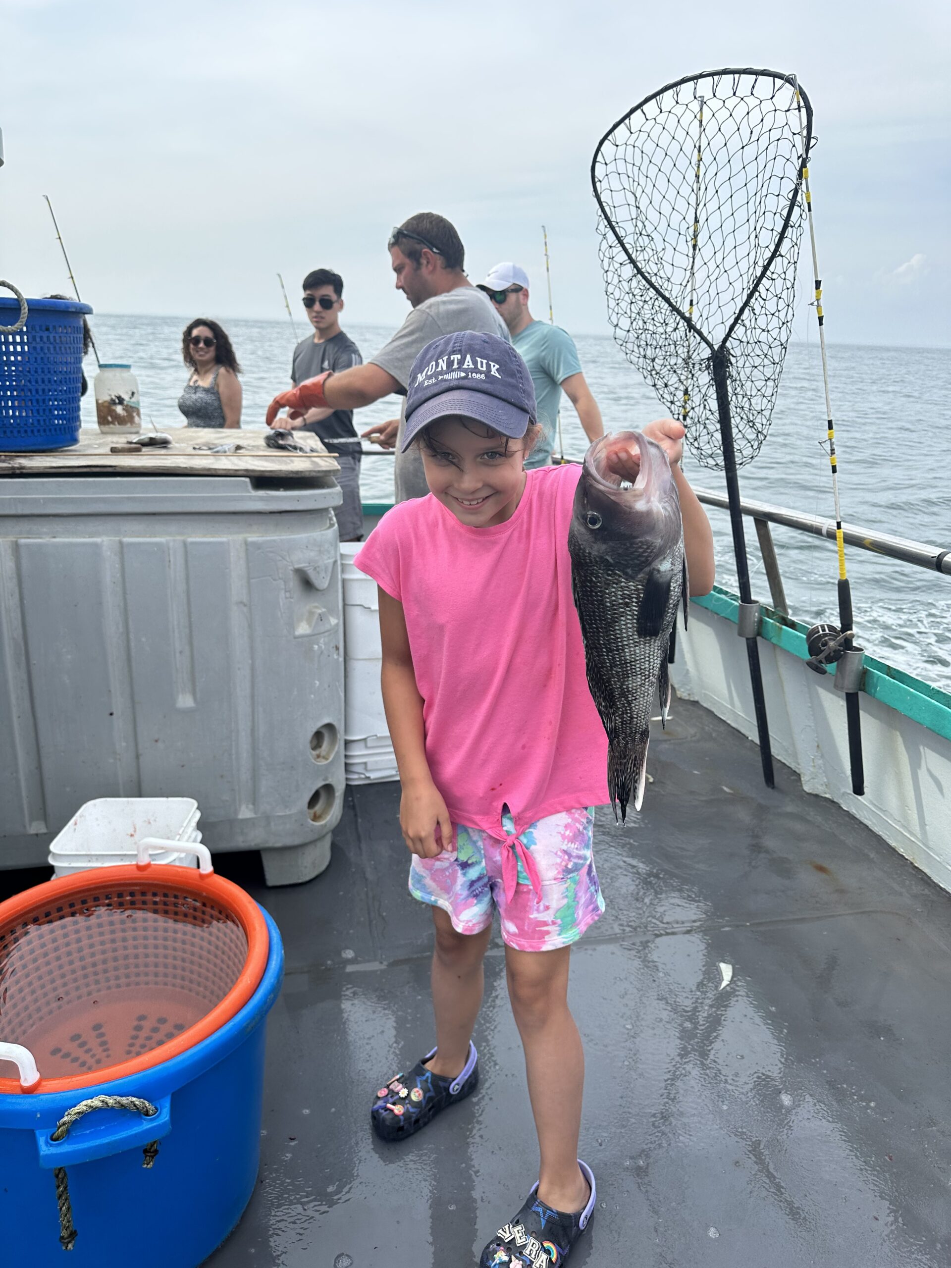 a little girl that is standing in the water