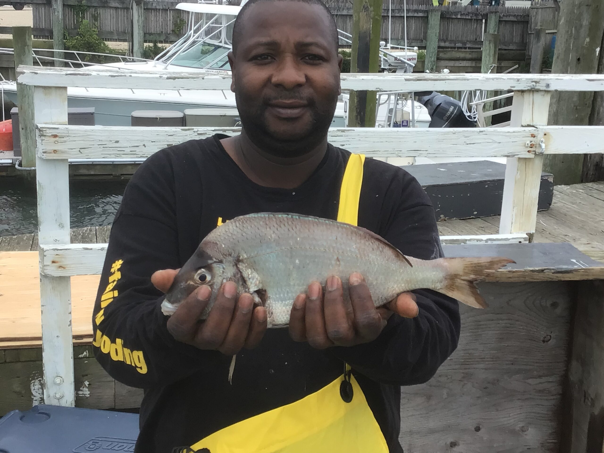 a man holding a fish