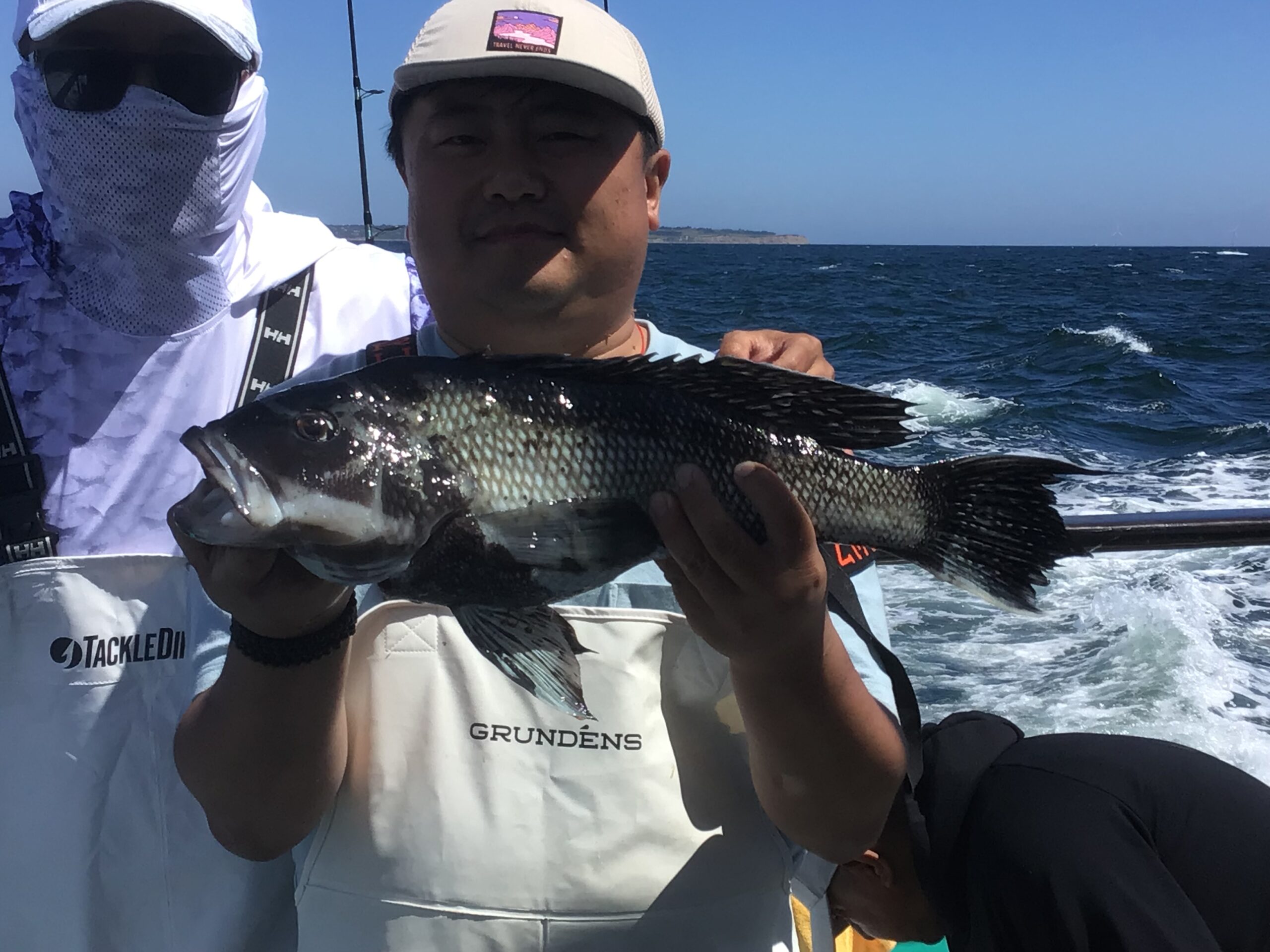 a person holding a fish in the water