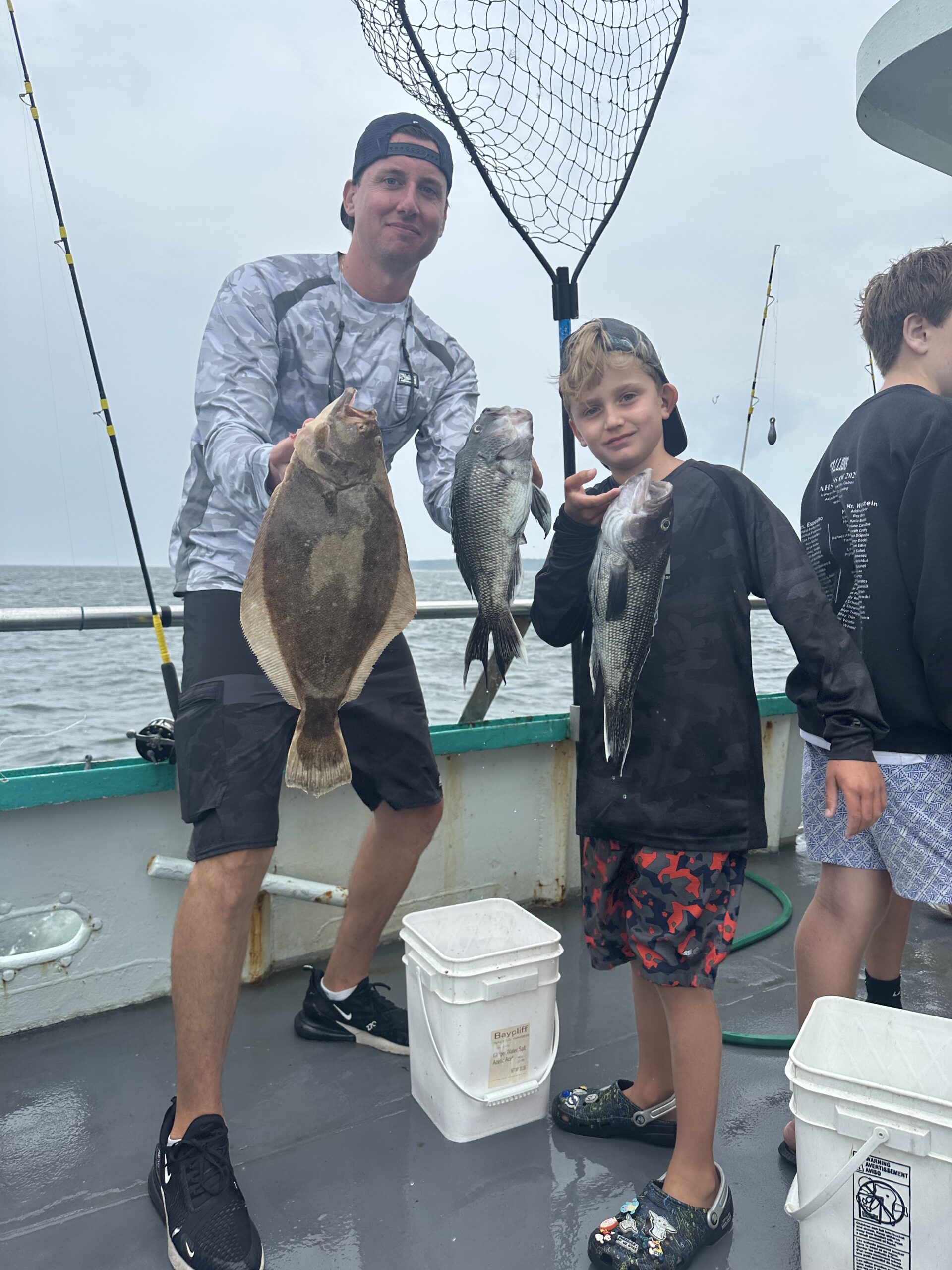 a man holding a fish in the water