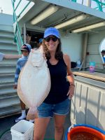 a person holding a fish