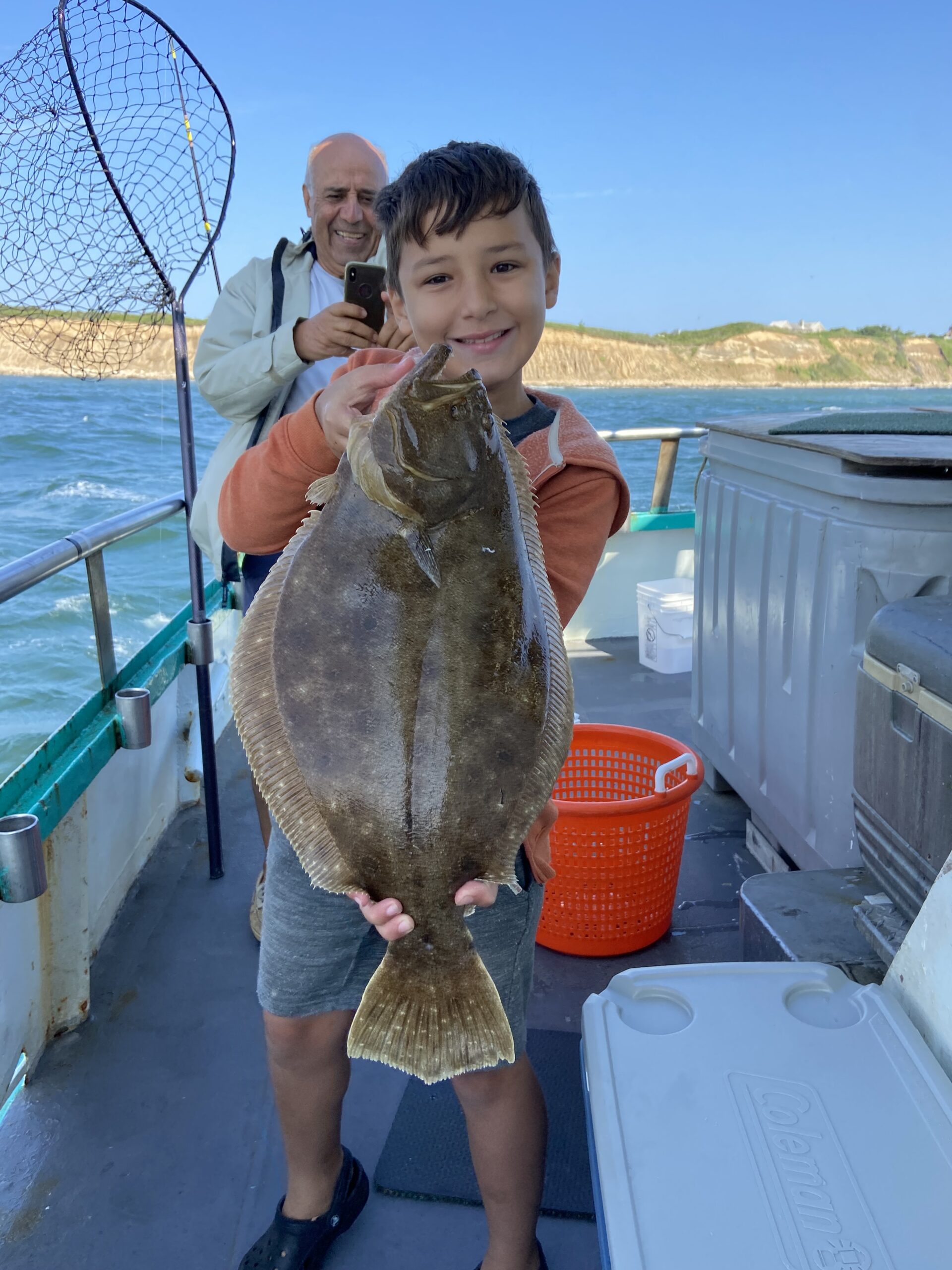 a person holding a fish in the water