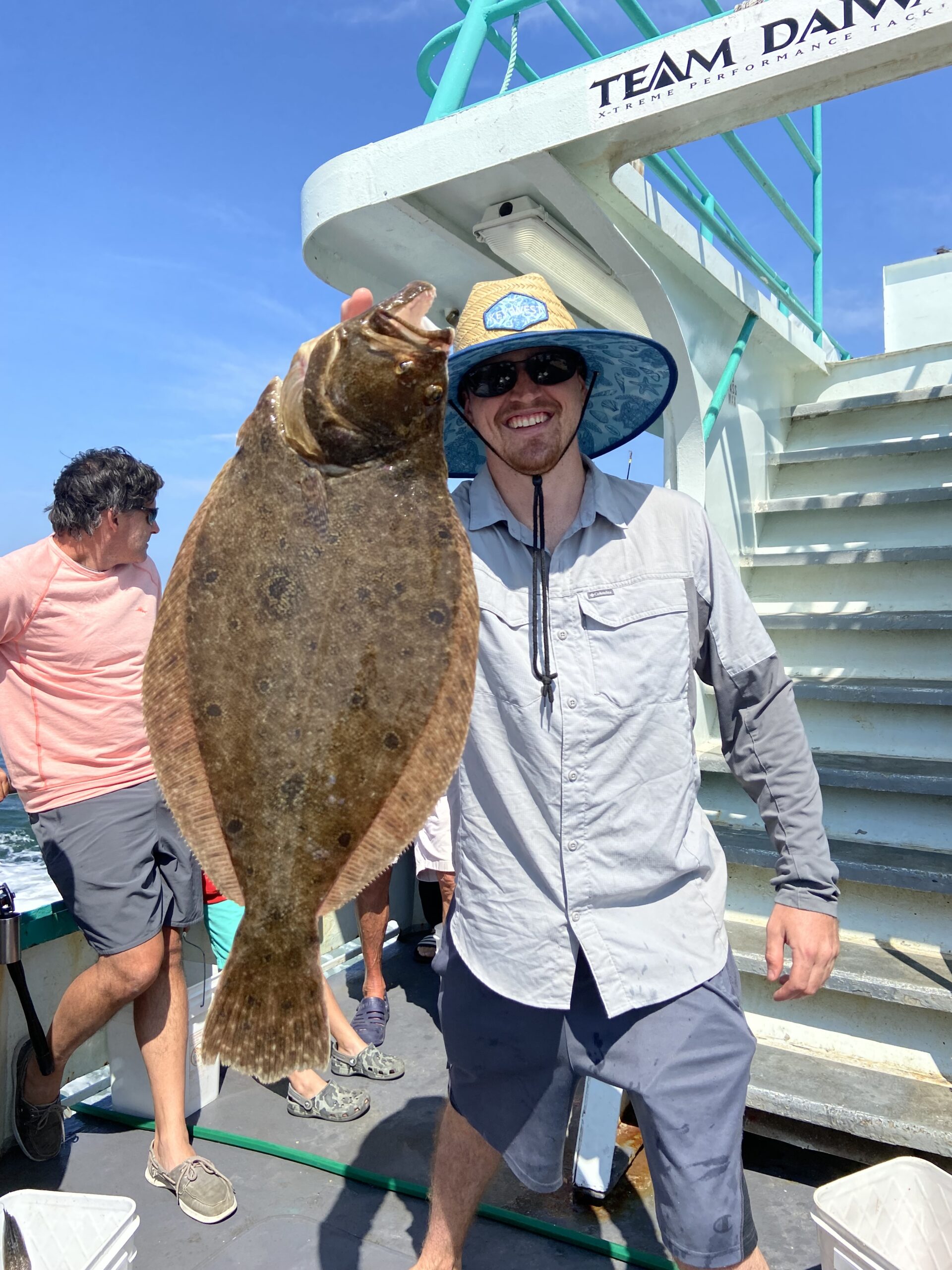 a man holding a fish