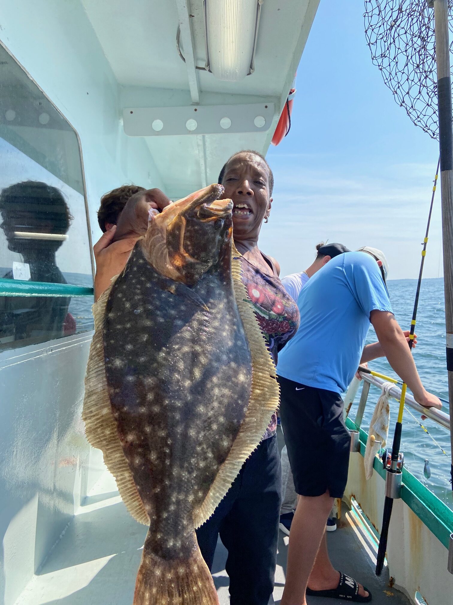 a person holding a fish