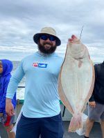 a person holding a fish