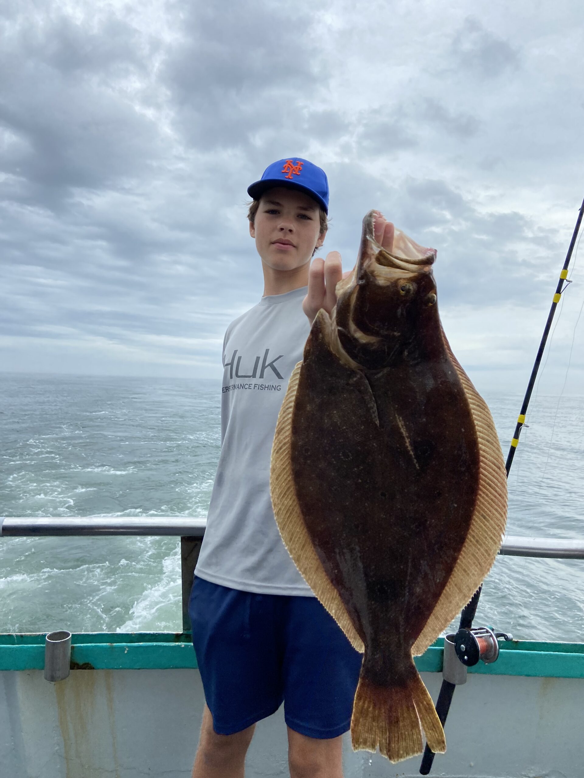 a person holding a fish in the water