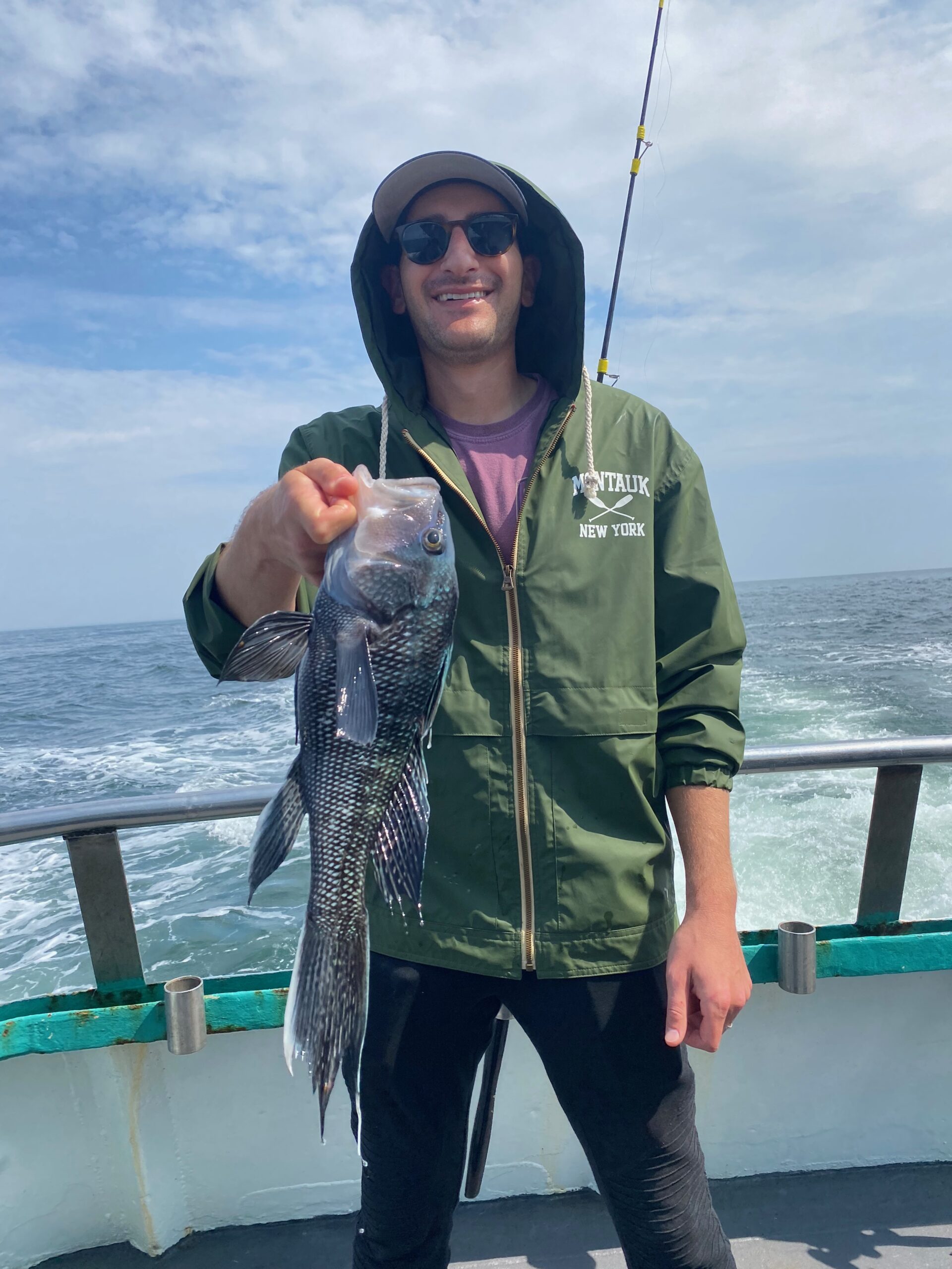 a person holding a fish in the water
