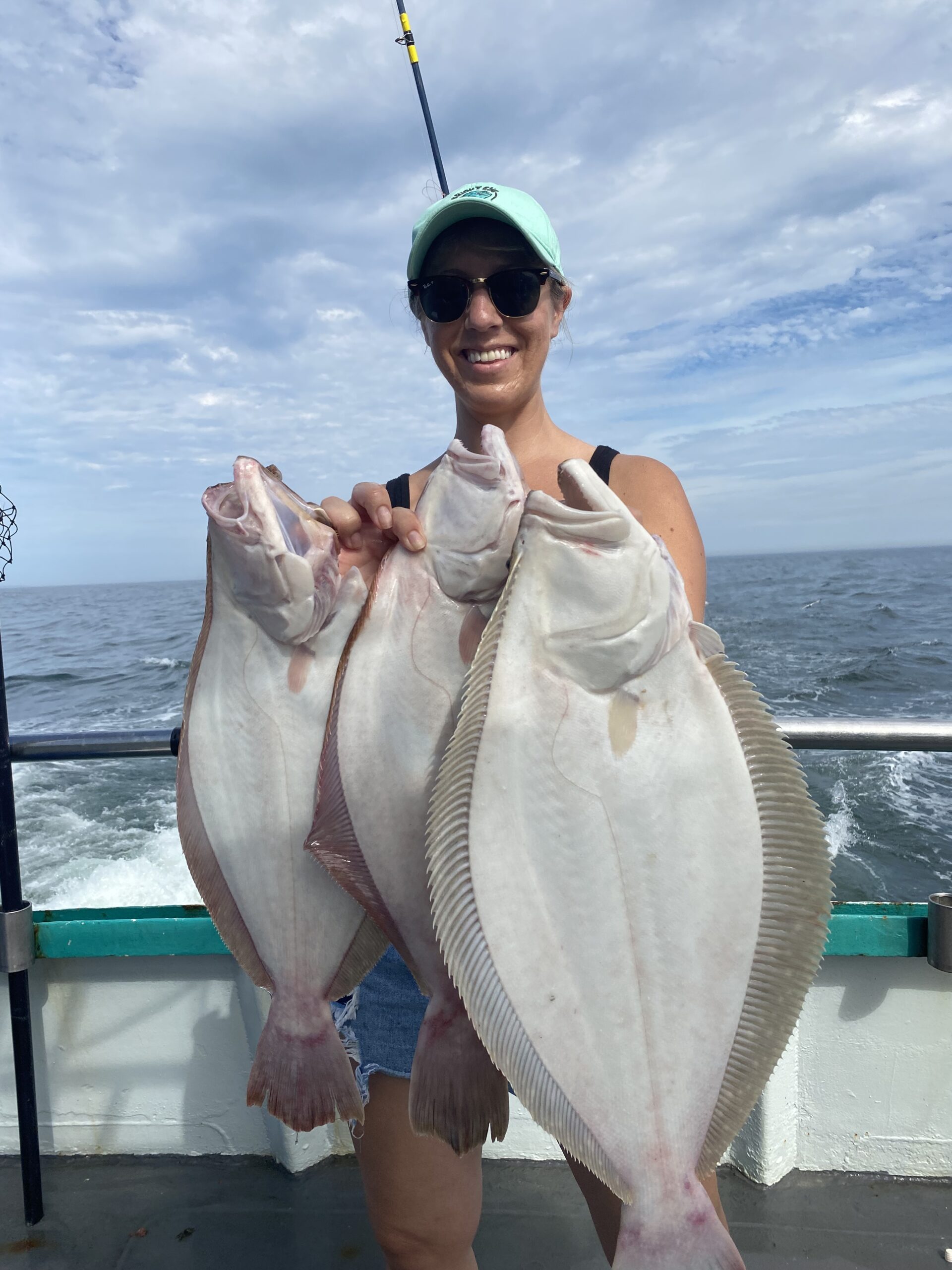 a person holding a fish in the water