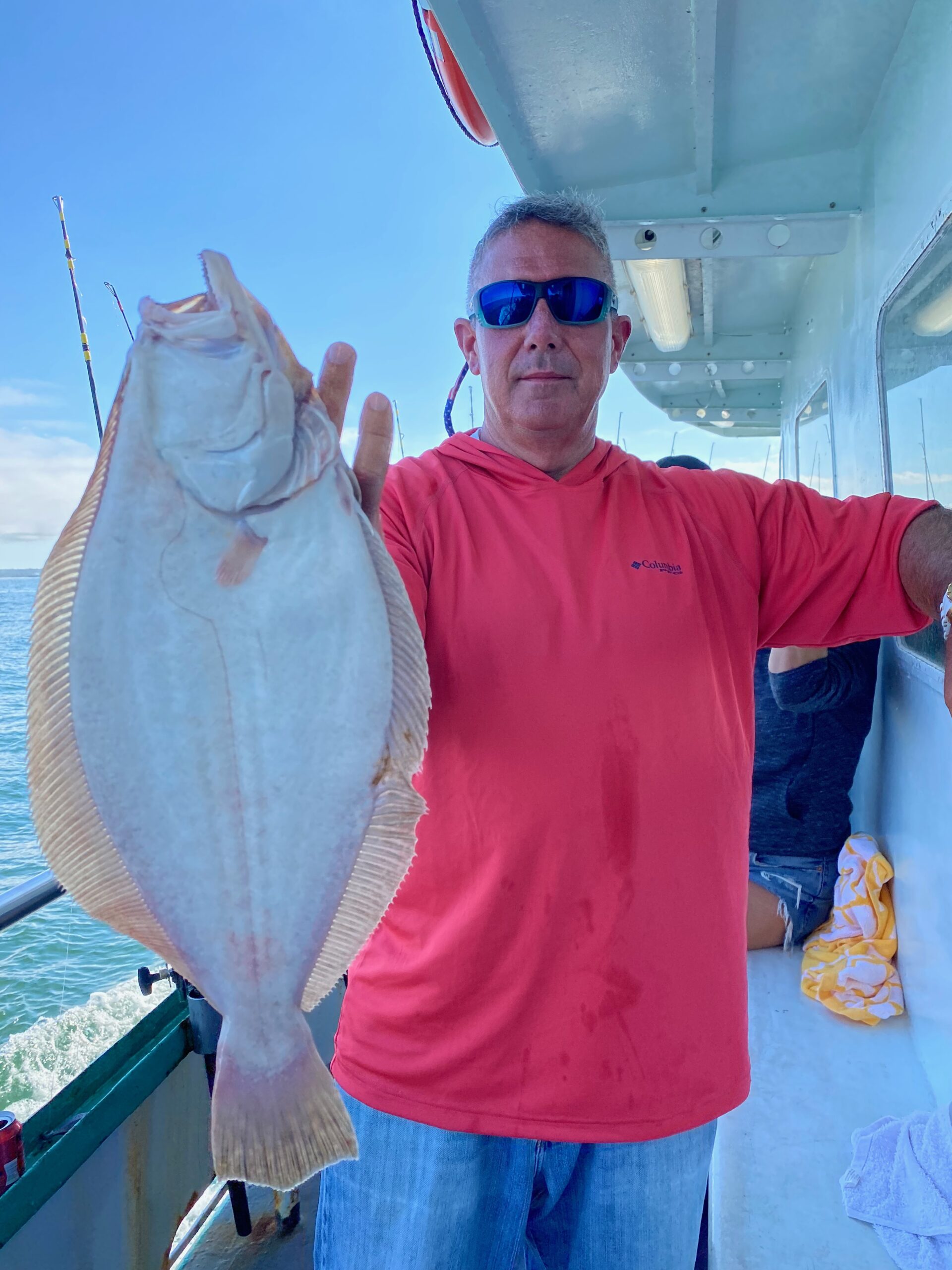 a man holding a fish