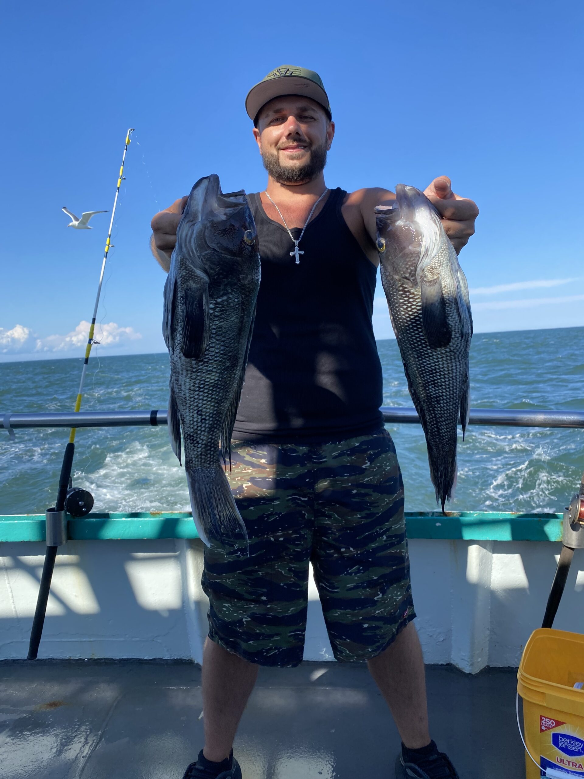 a person holding a fish in the water
