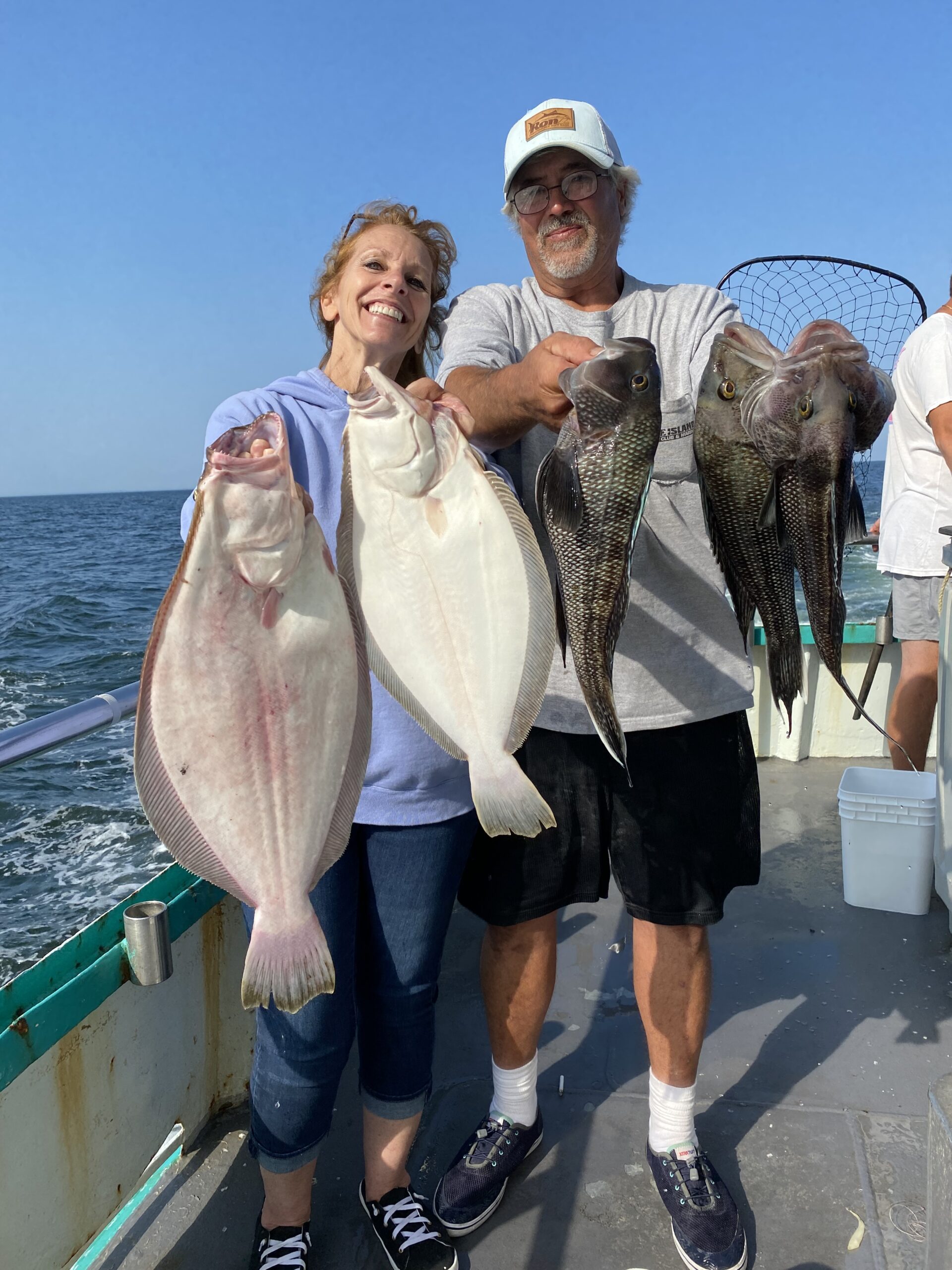 a man holding a fish