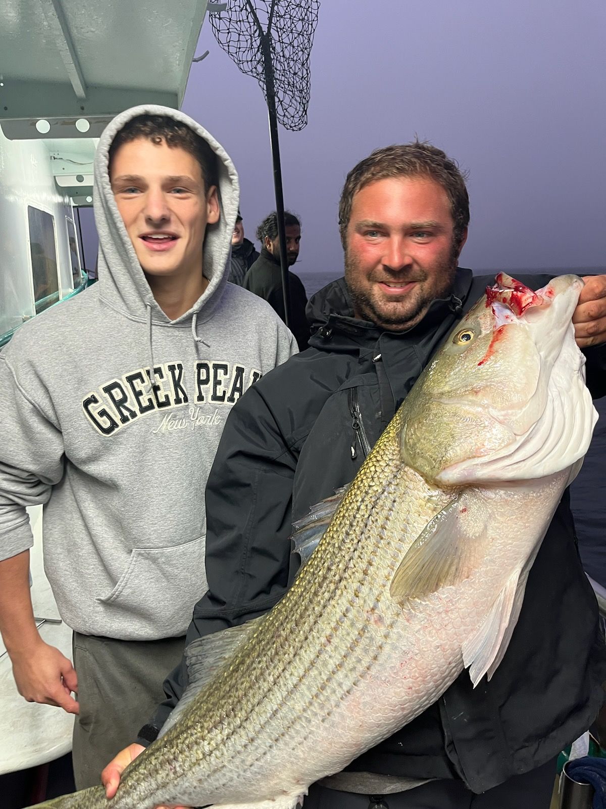 a person holding a fish