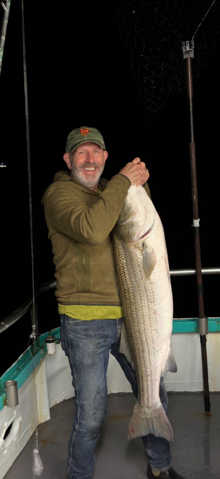 a man holding a fish