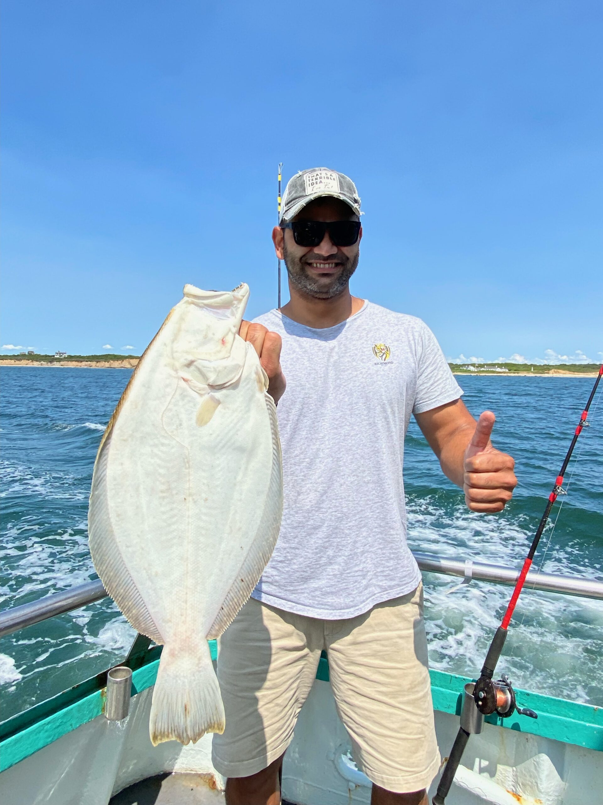 a man holding a fish in the water