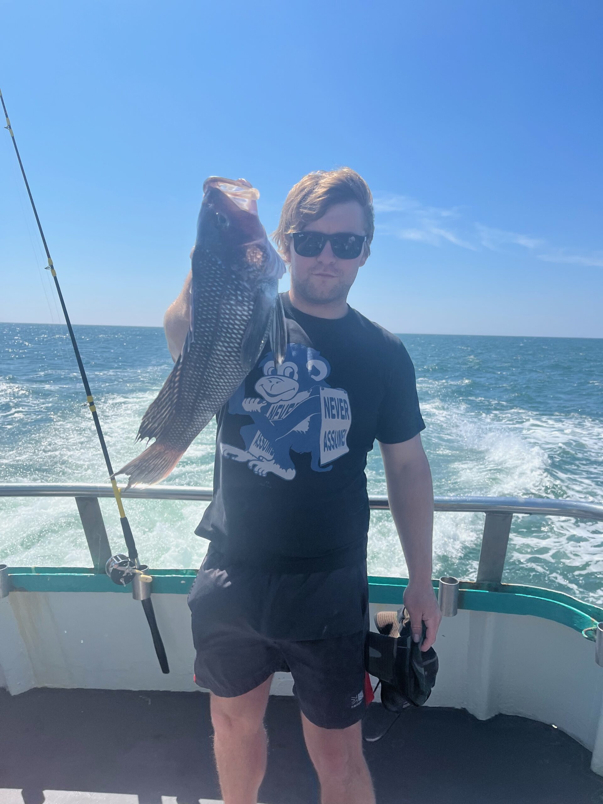 a man and a woman standing next to a body of water
