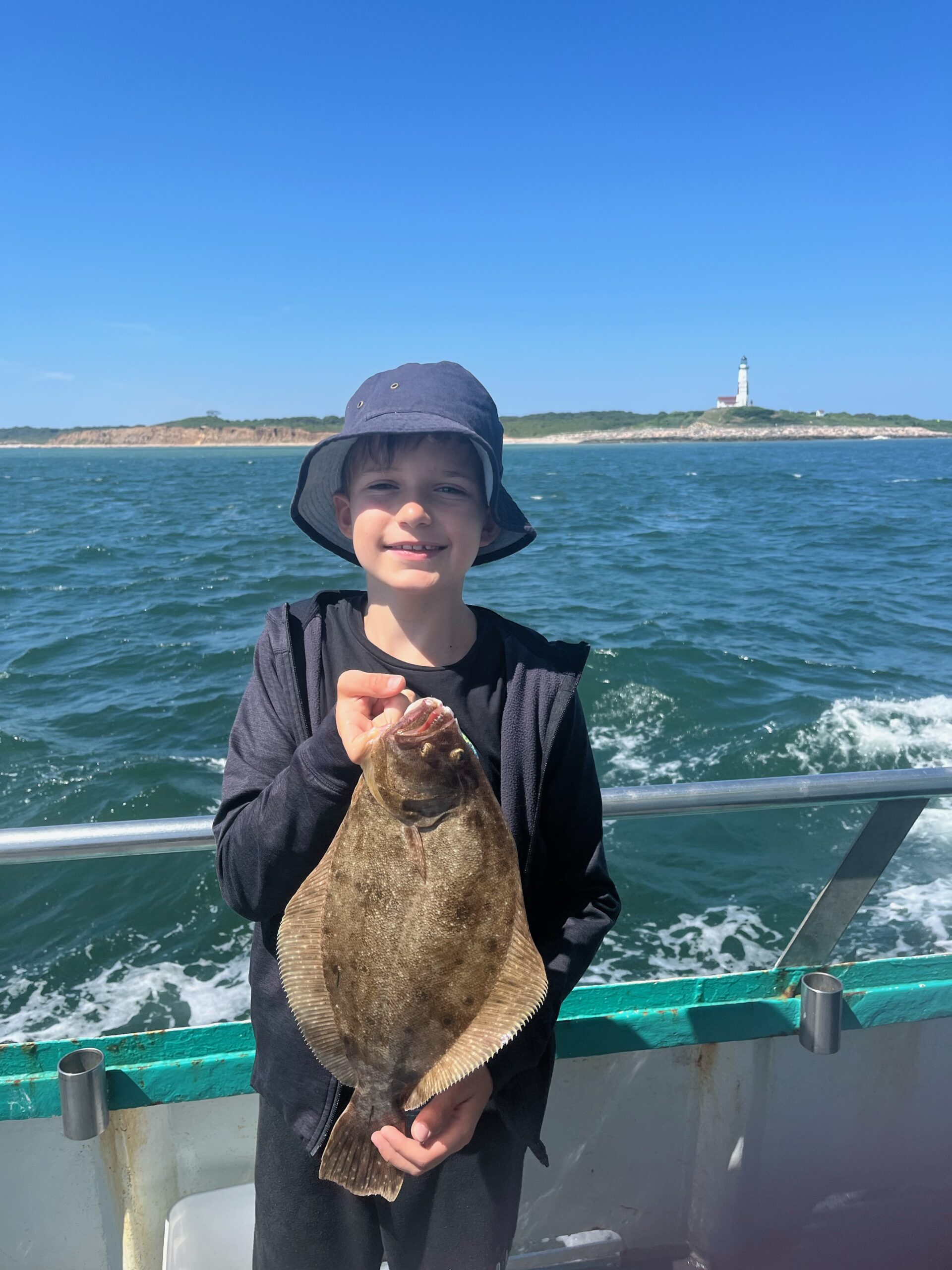 a person standing in front of a body of water