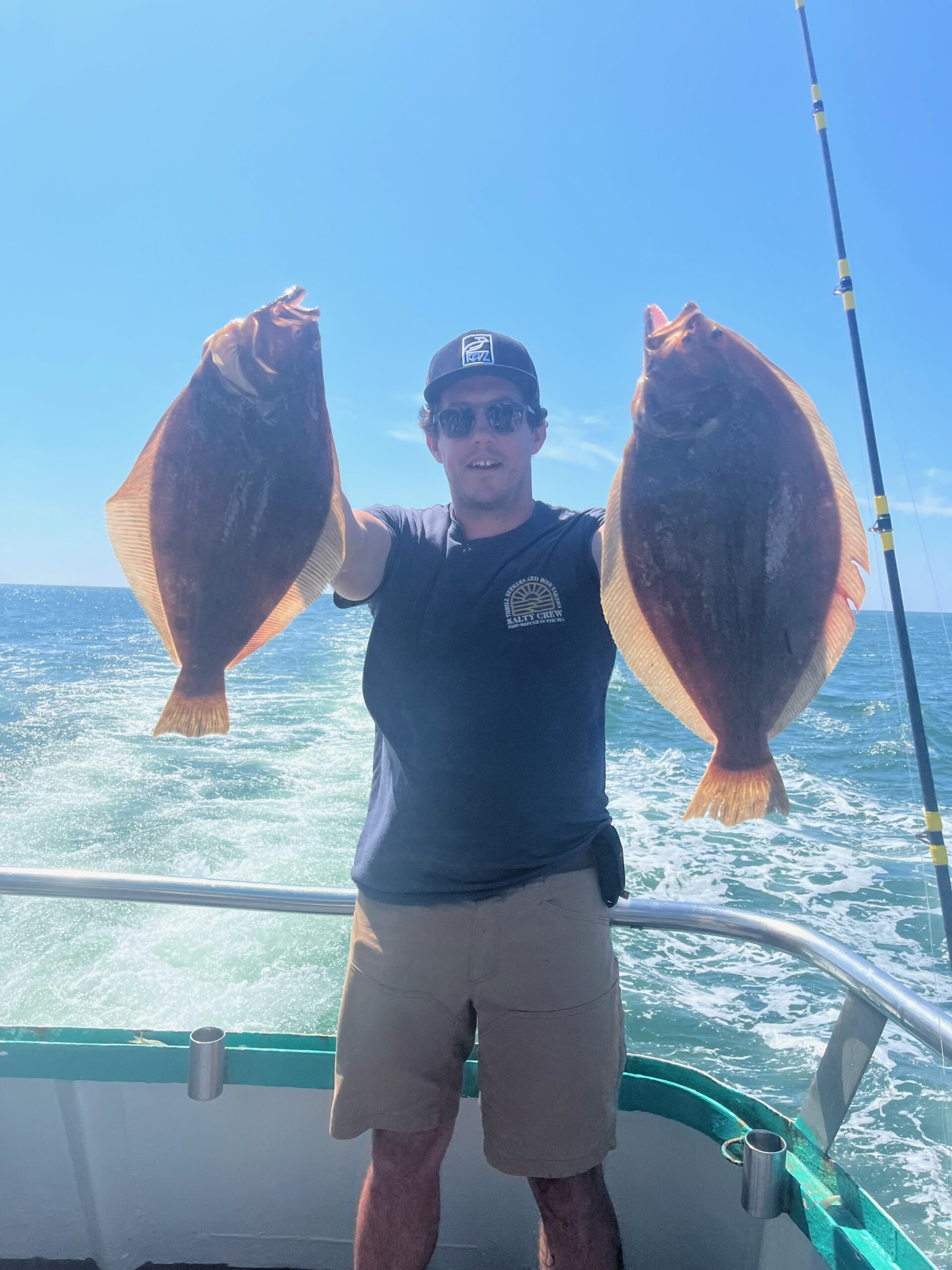 a person holding a fish in the water