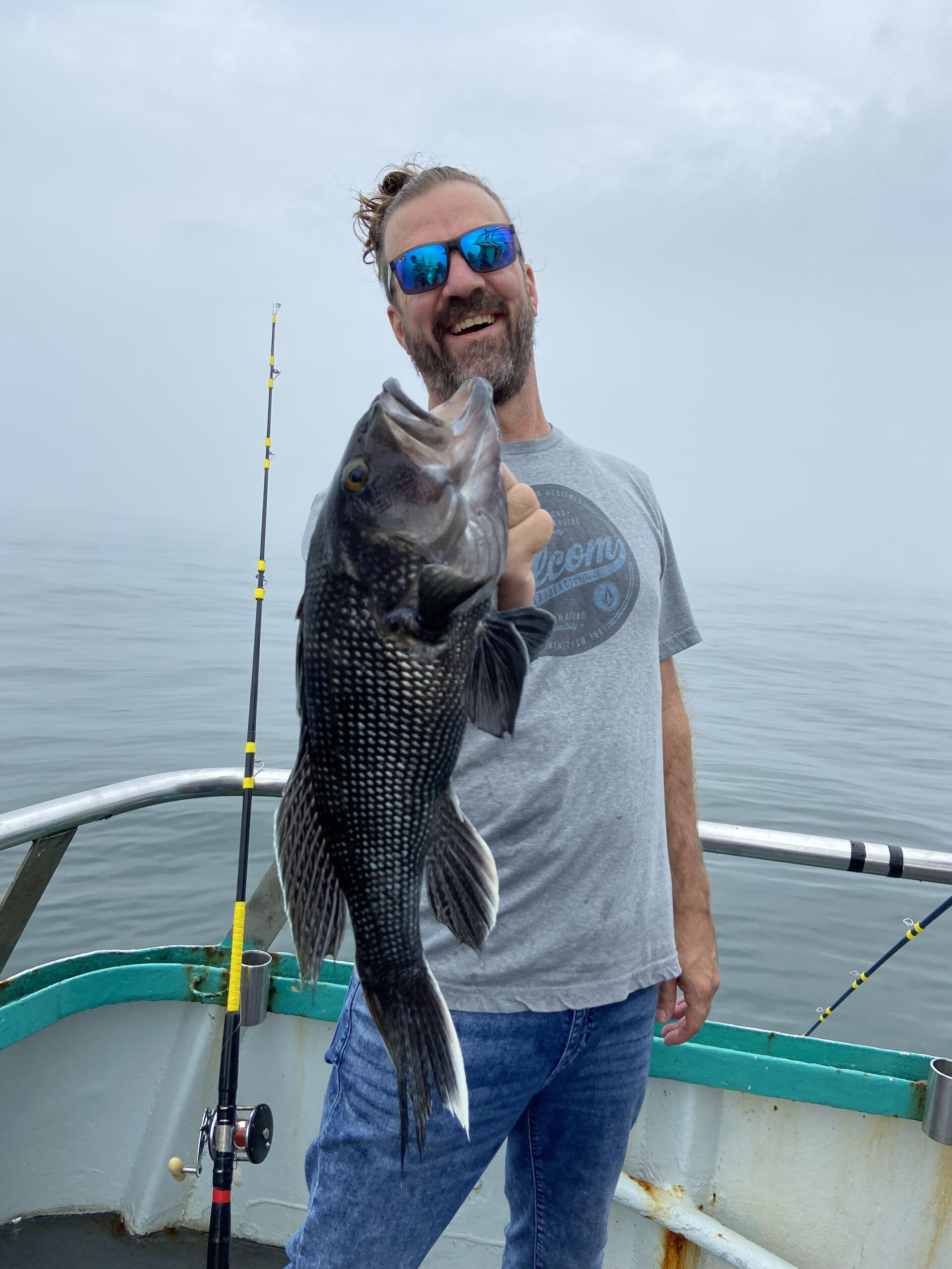 a person holding a fish in the water