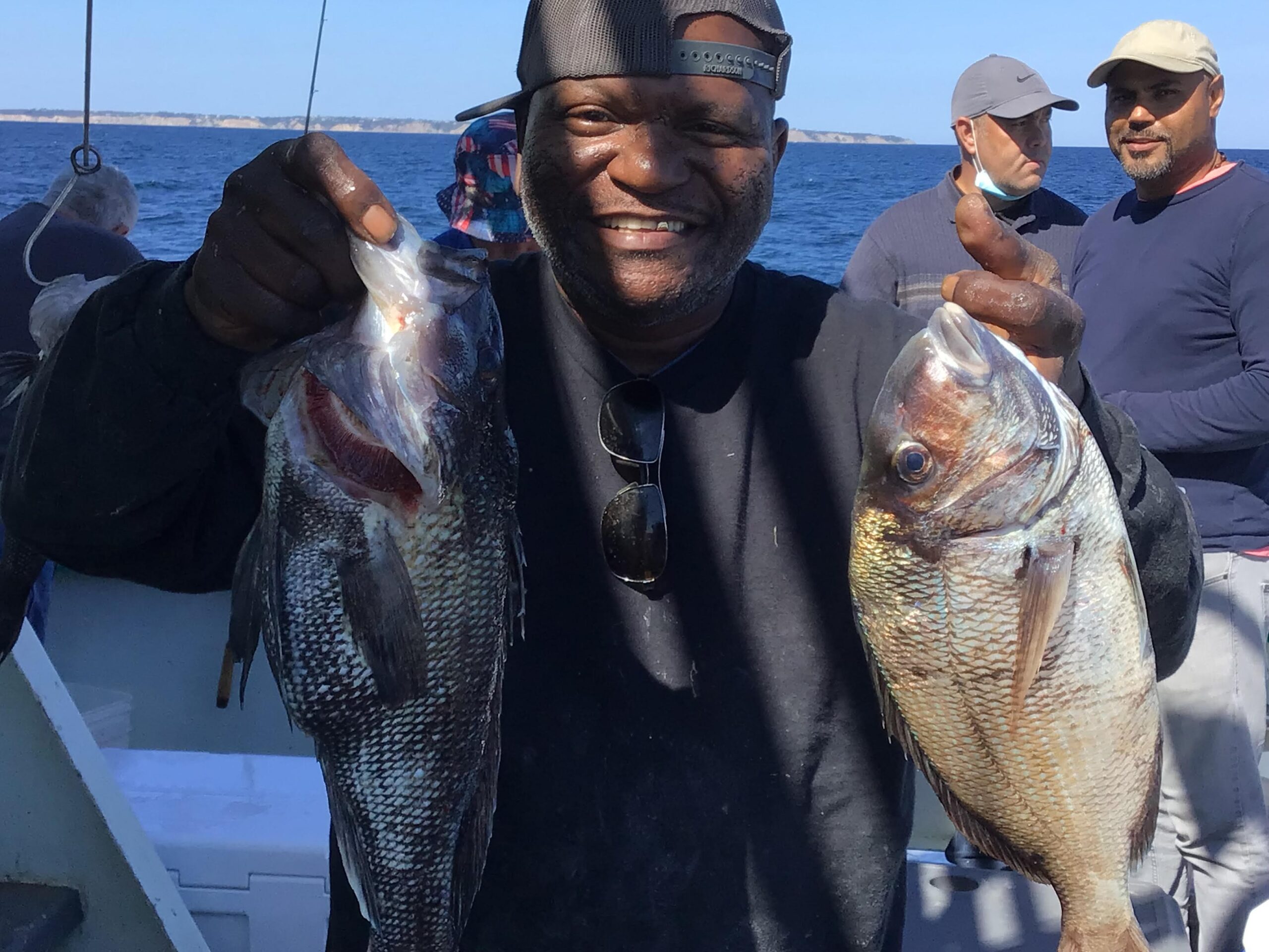 a man holding a fish