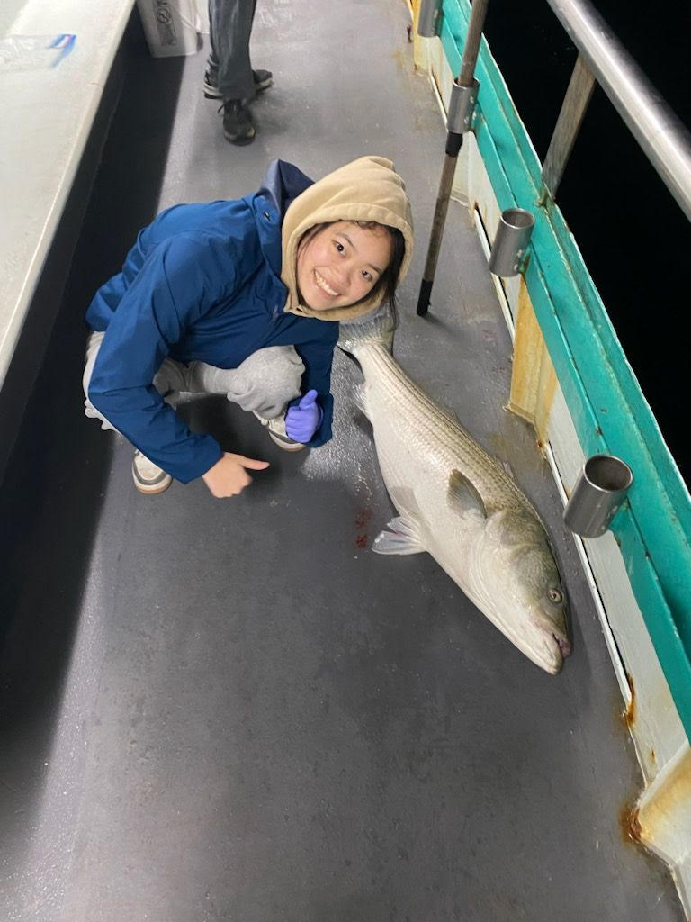 a person holding a fish