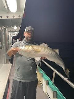 a man holding a fish