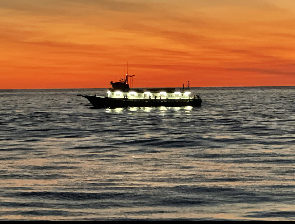 a small boat in a large body of water