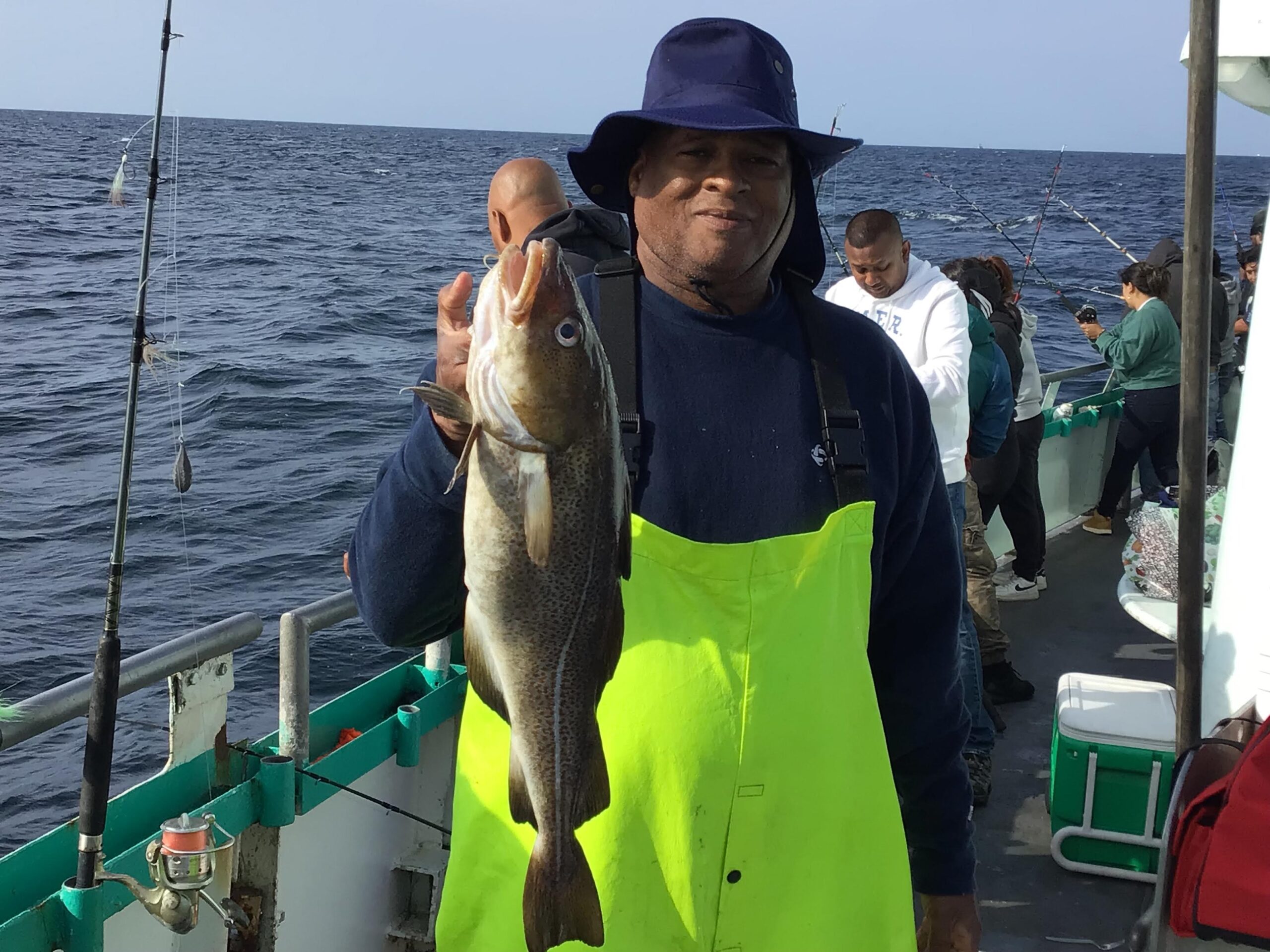a person holding a fish in the water