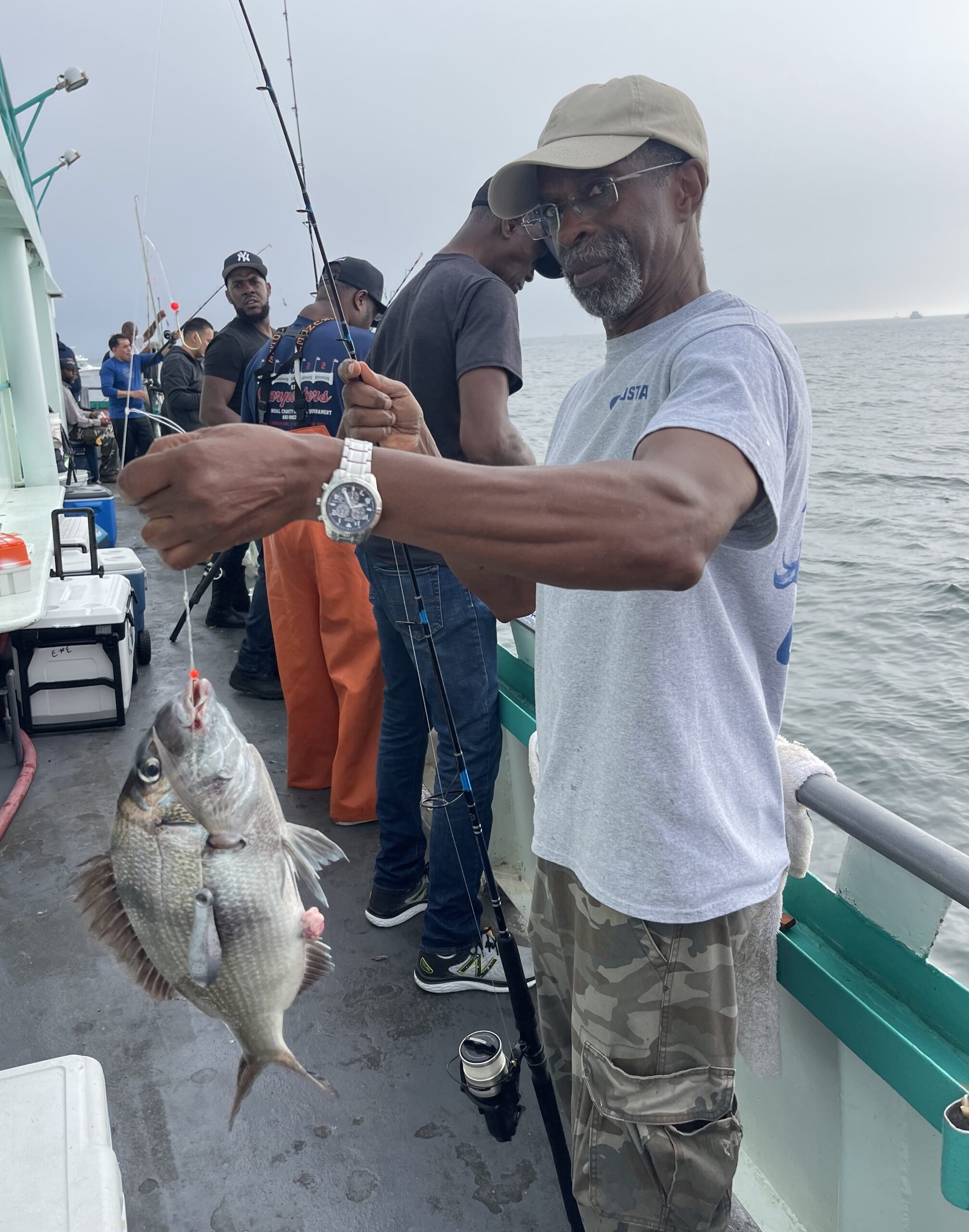 a man holding a fish