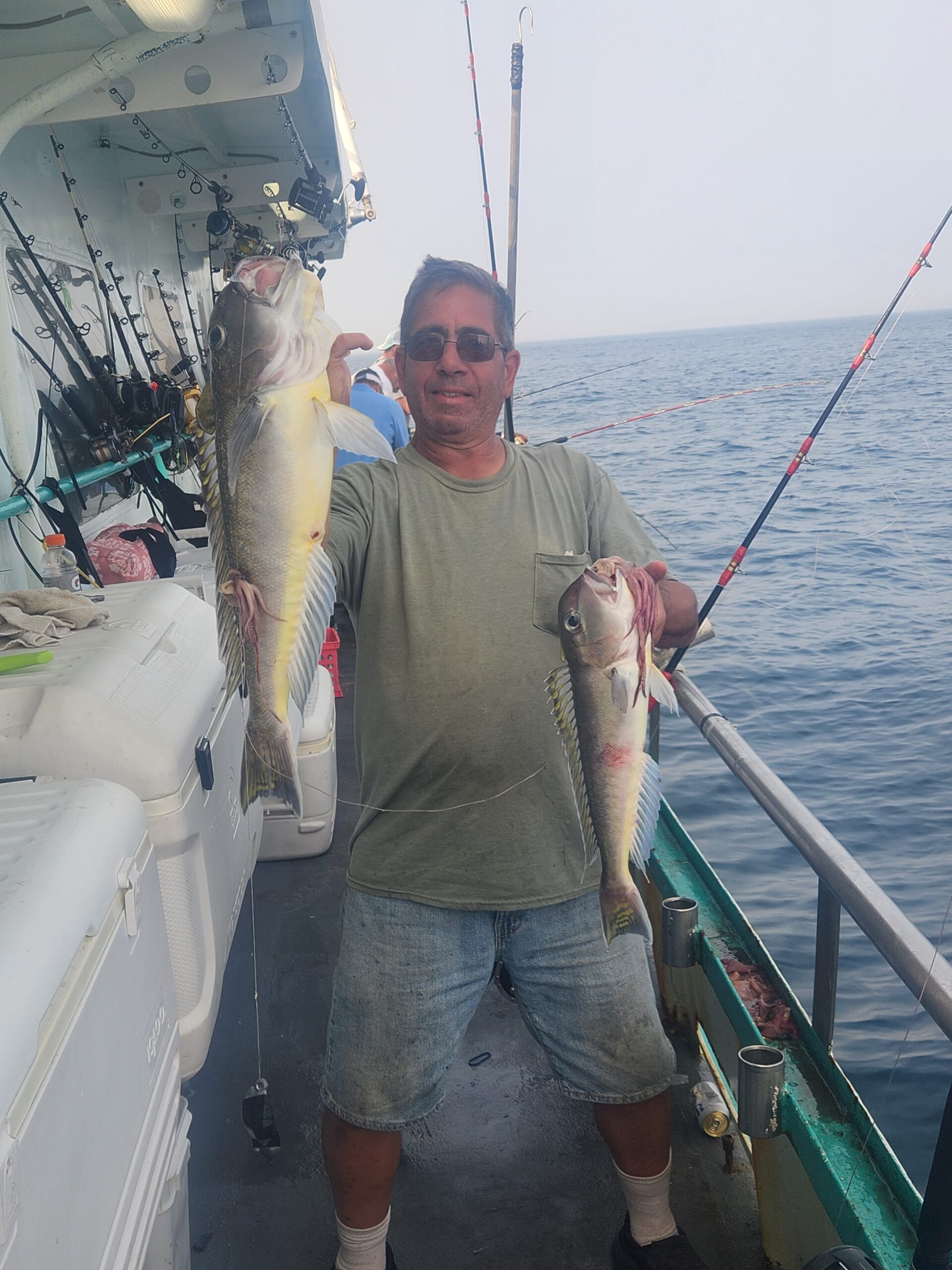 a man holding a fish in the water