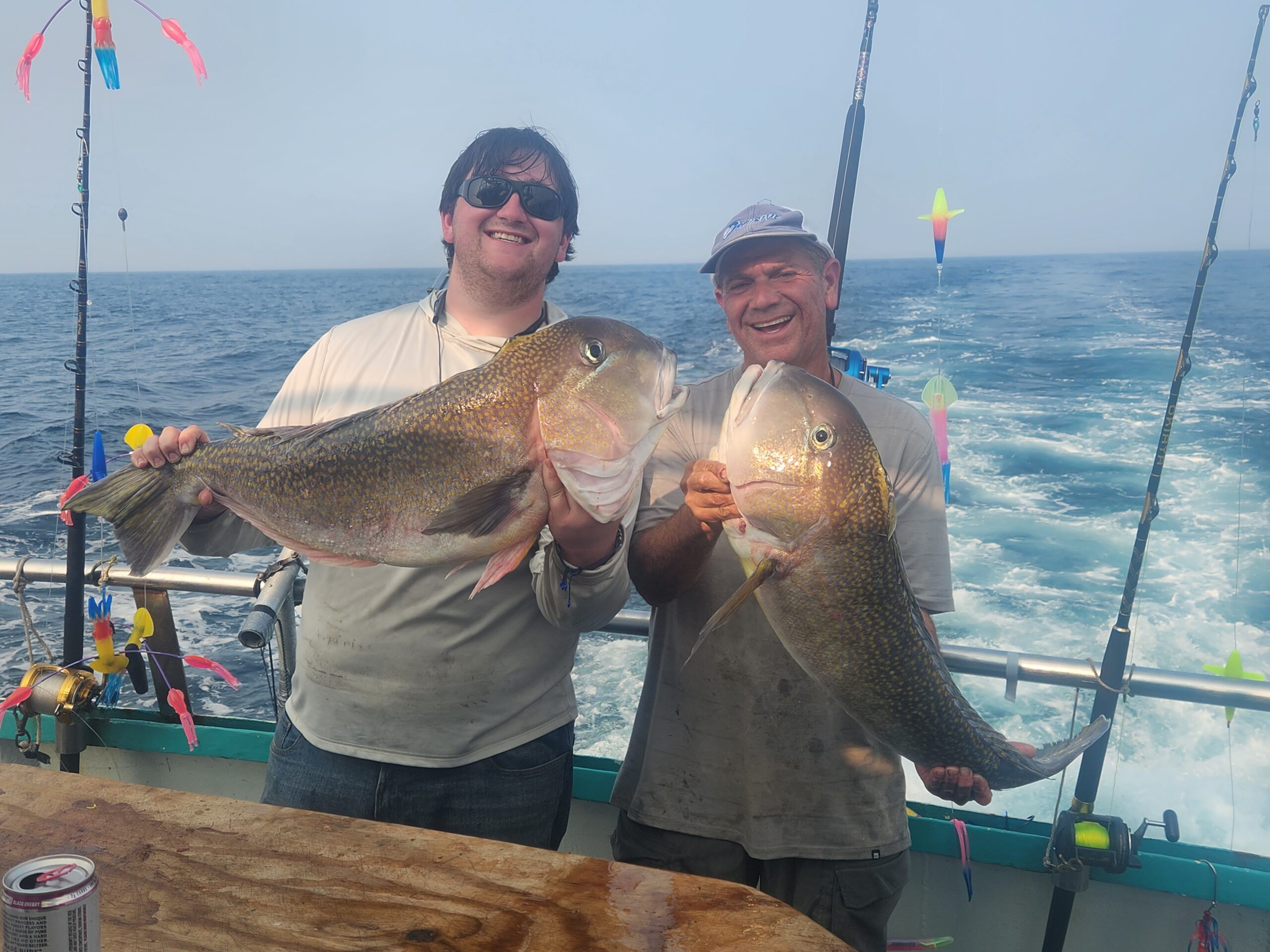 a person holding a fish in the water