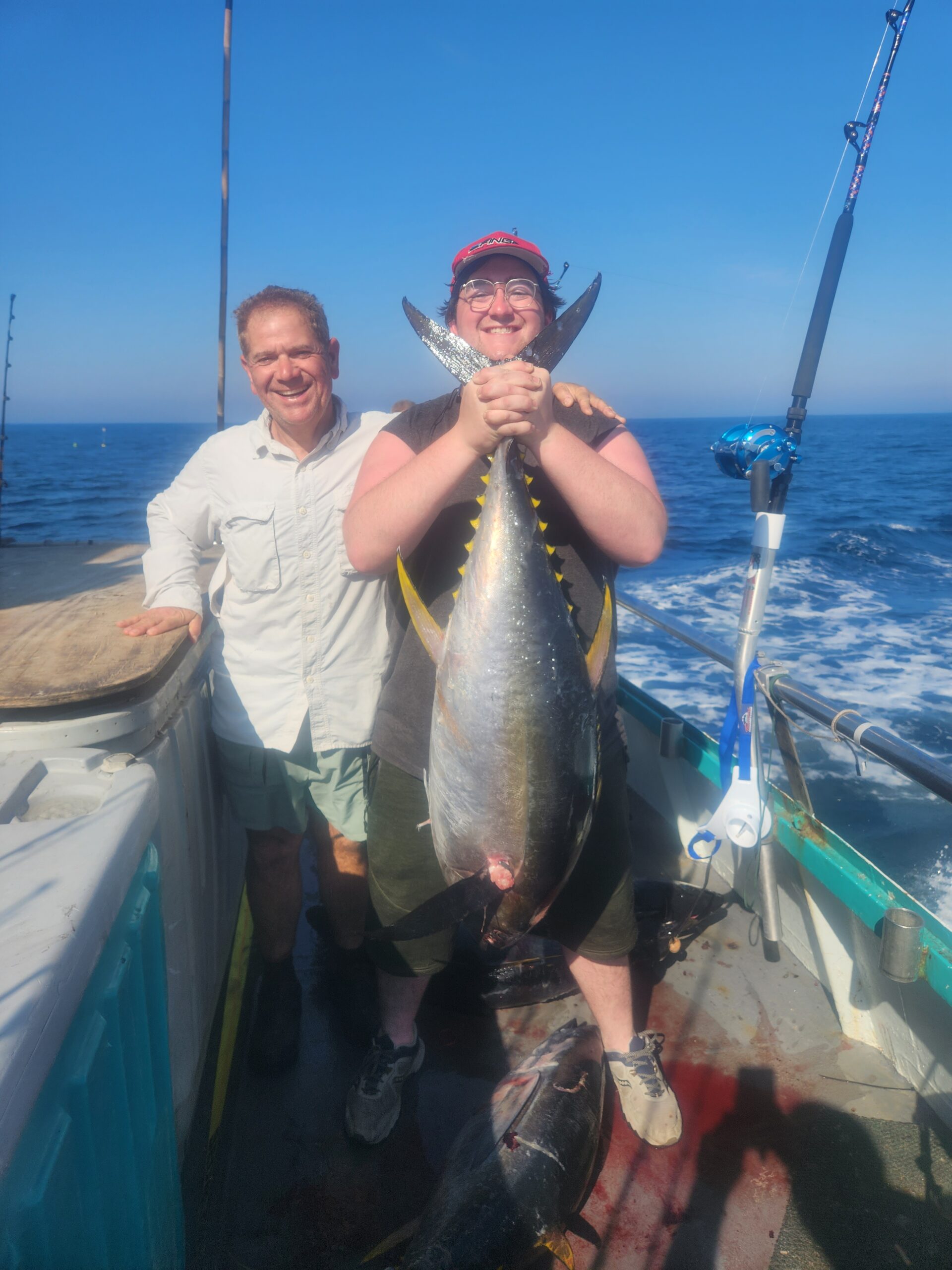 a man holding a fish