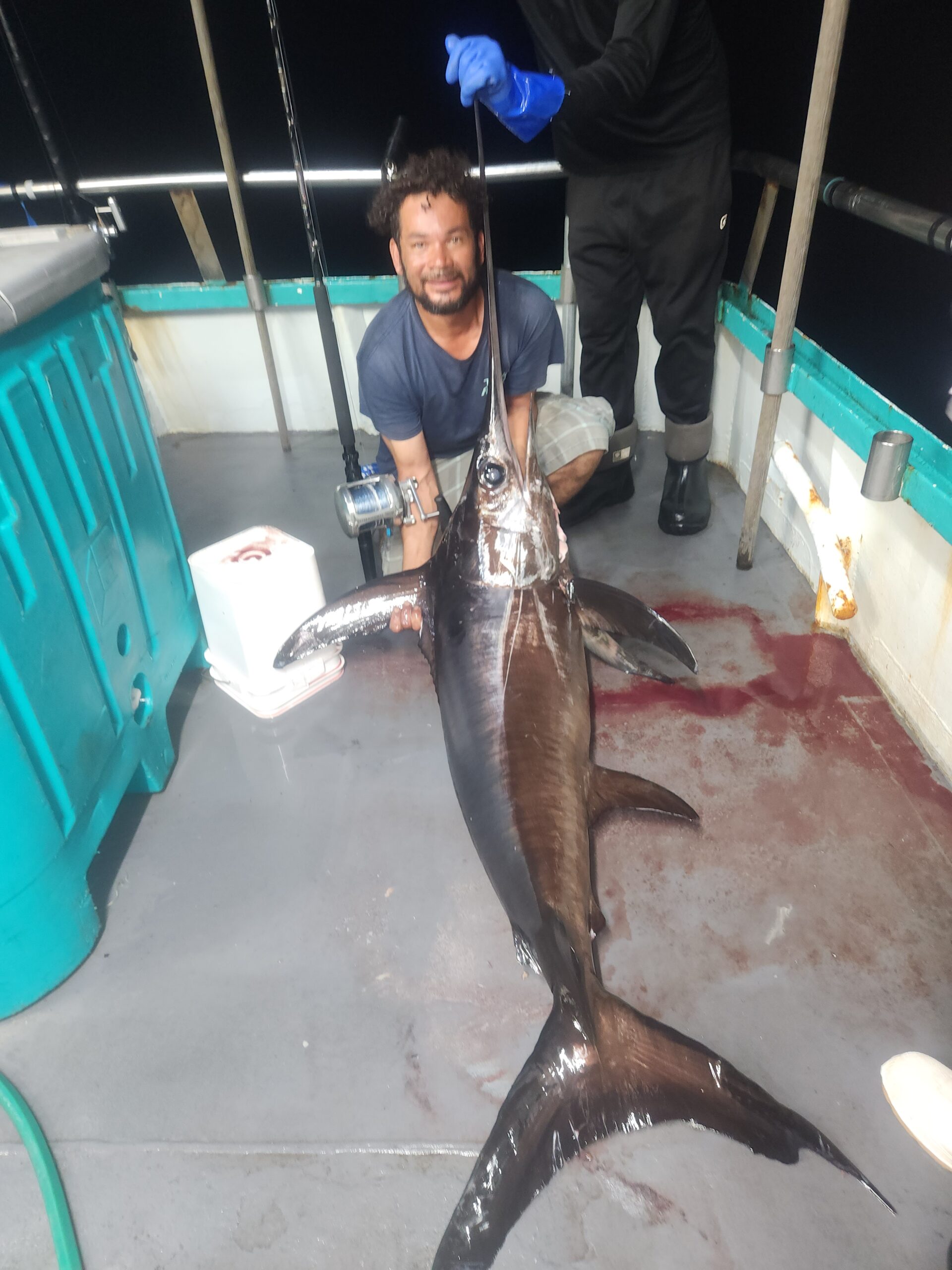 a man holding a fish