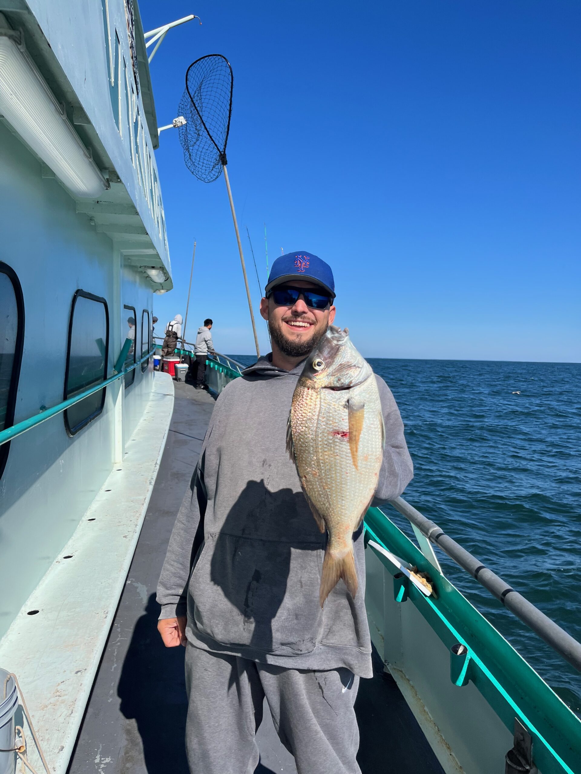 a person holding a fish in the water