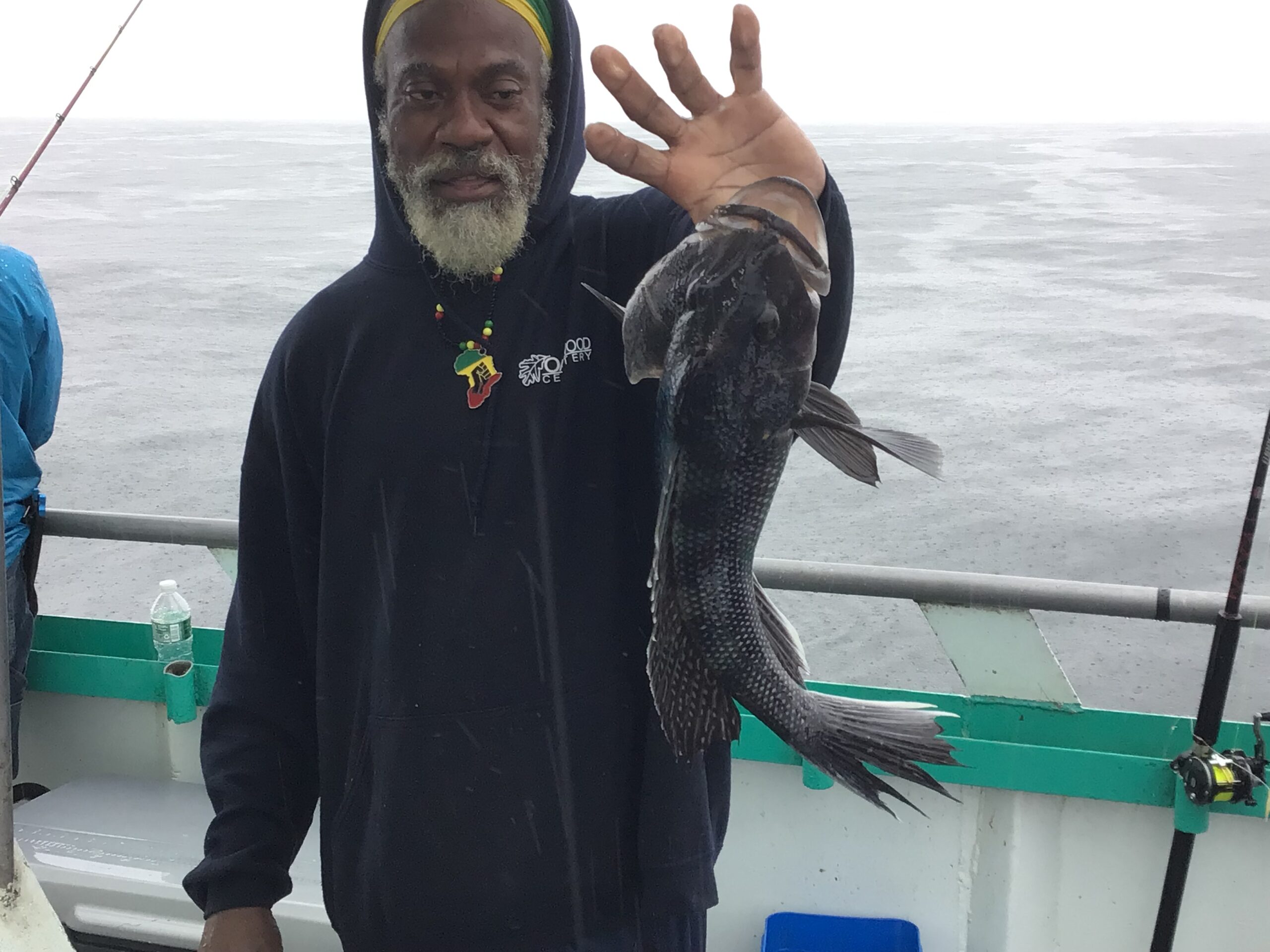 a man standing on a boat in the water