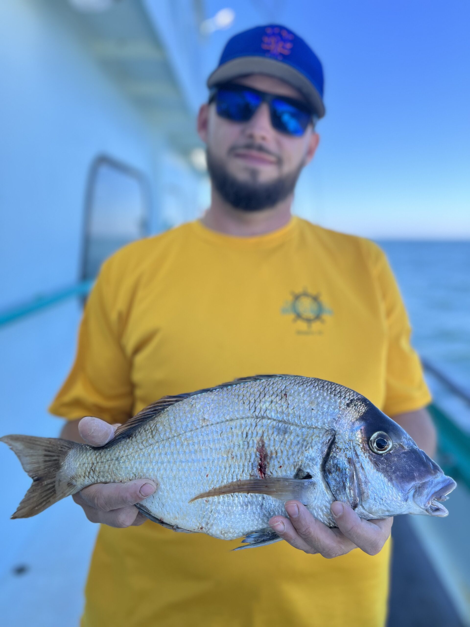 a man holding a fish