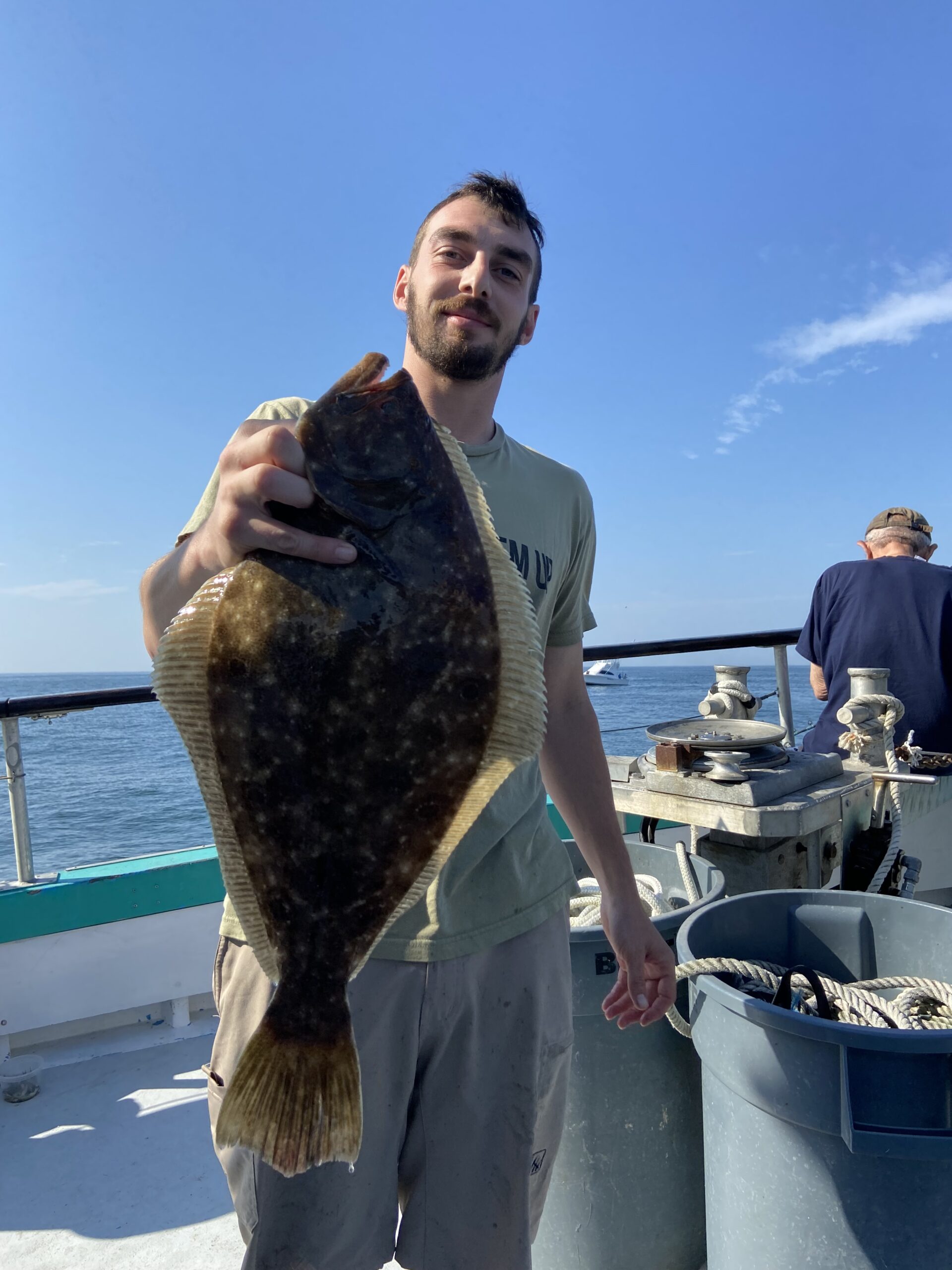 a man standing on a boat in the water