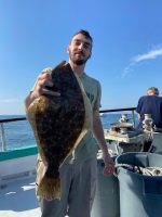 a man standing on a boat in the water