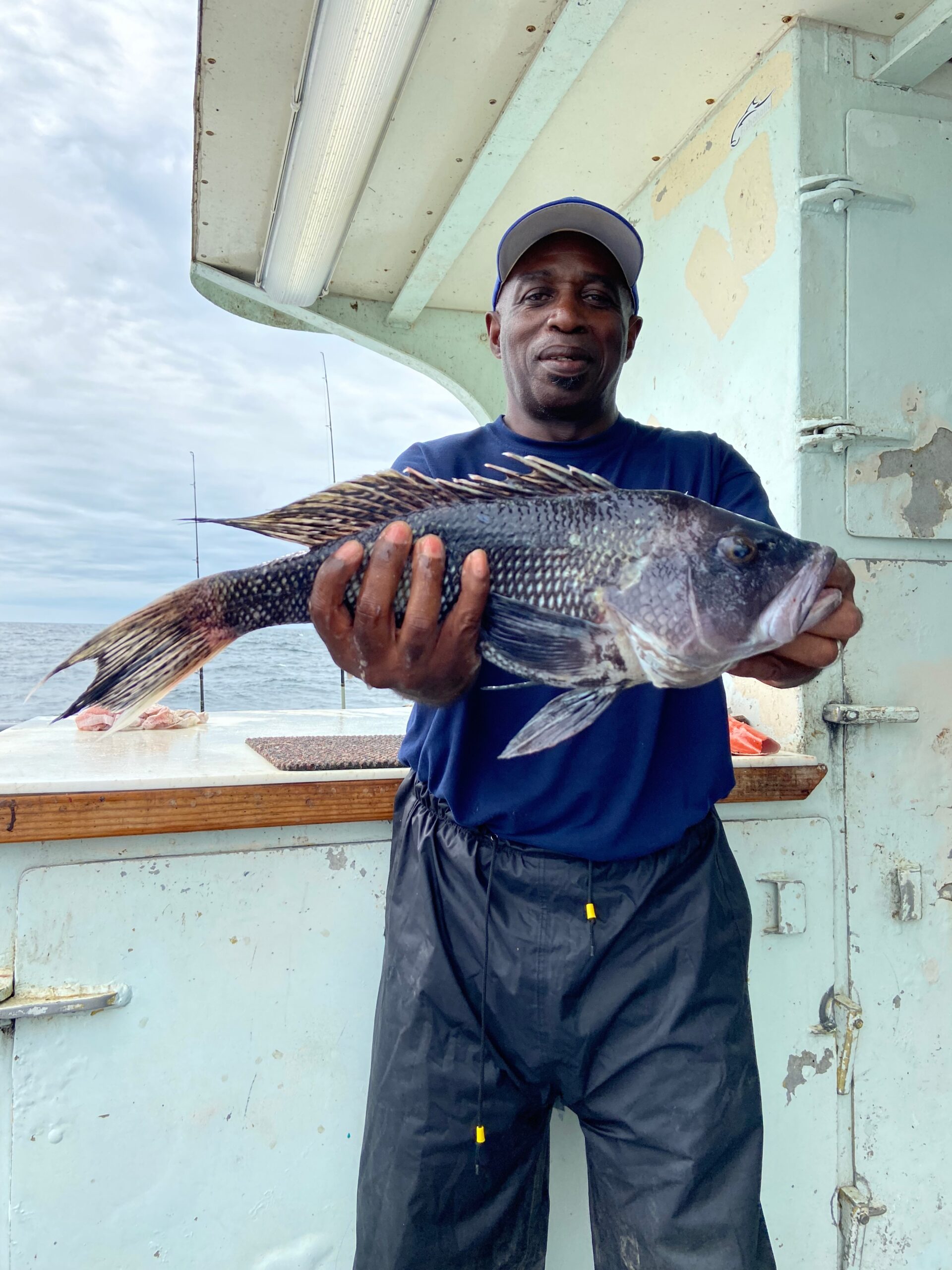 a man holding a fish