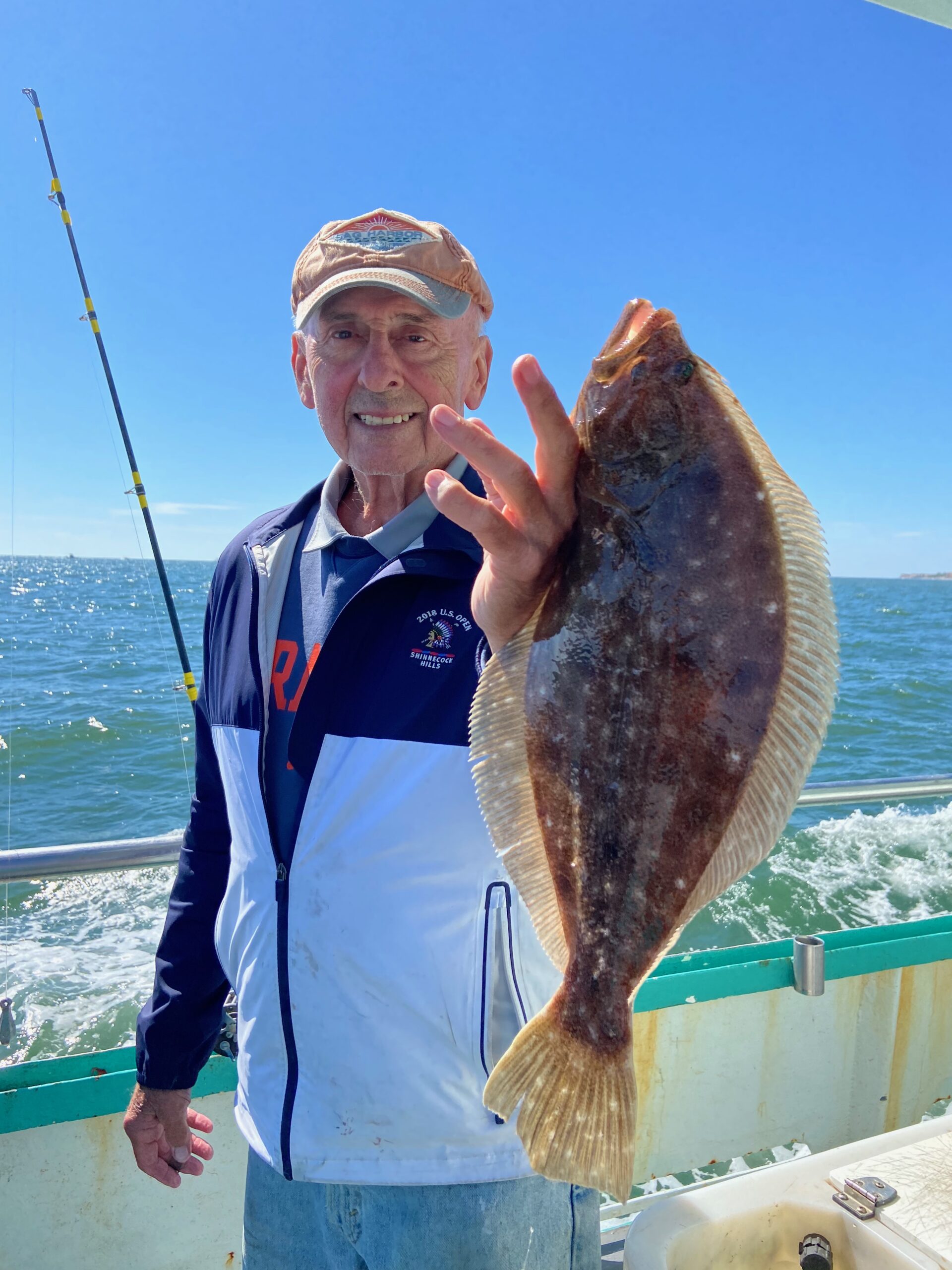 a person holding a fish in the water