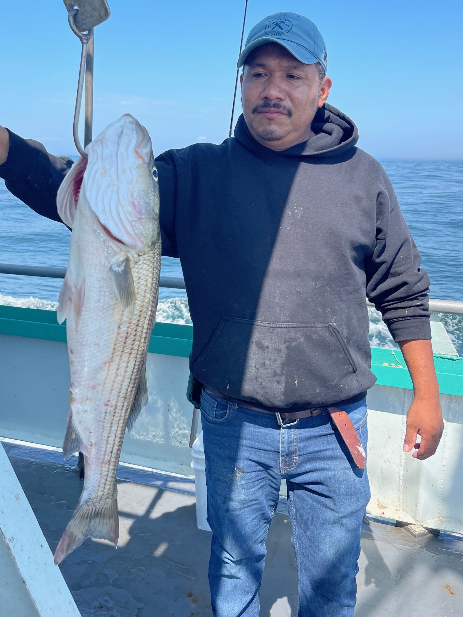 a person holding a fish in the water
