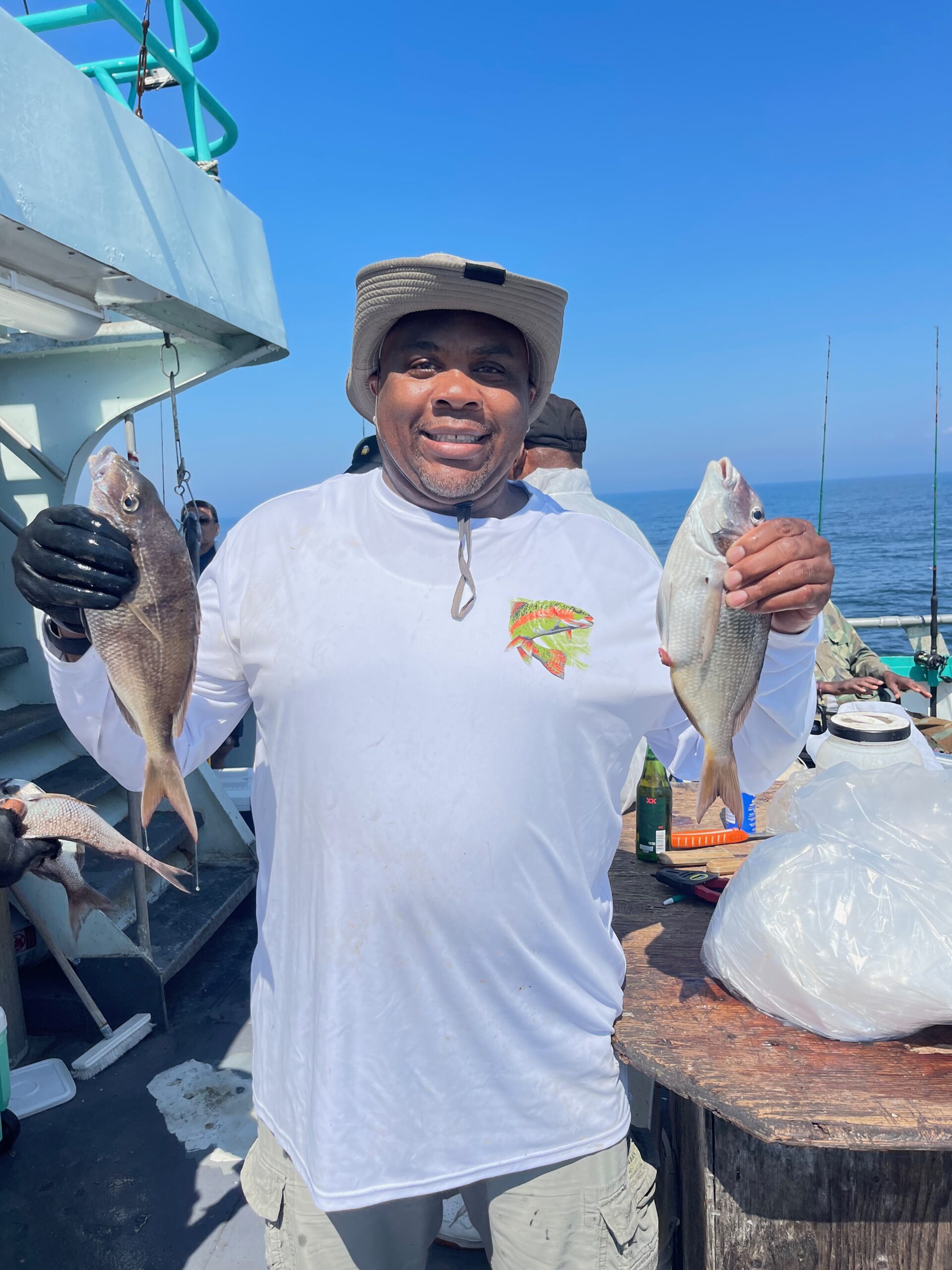 a man standing next to a boat