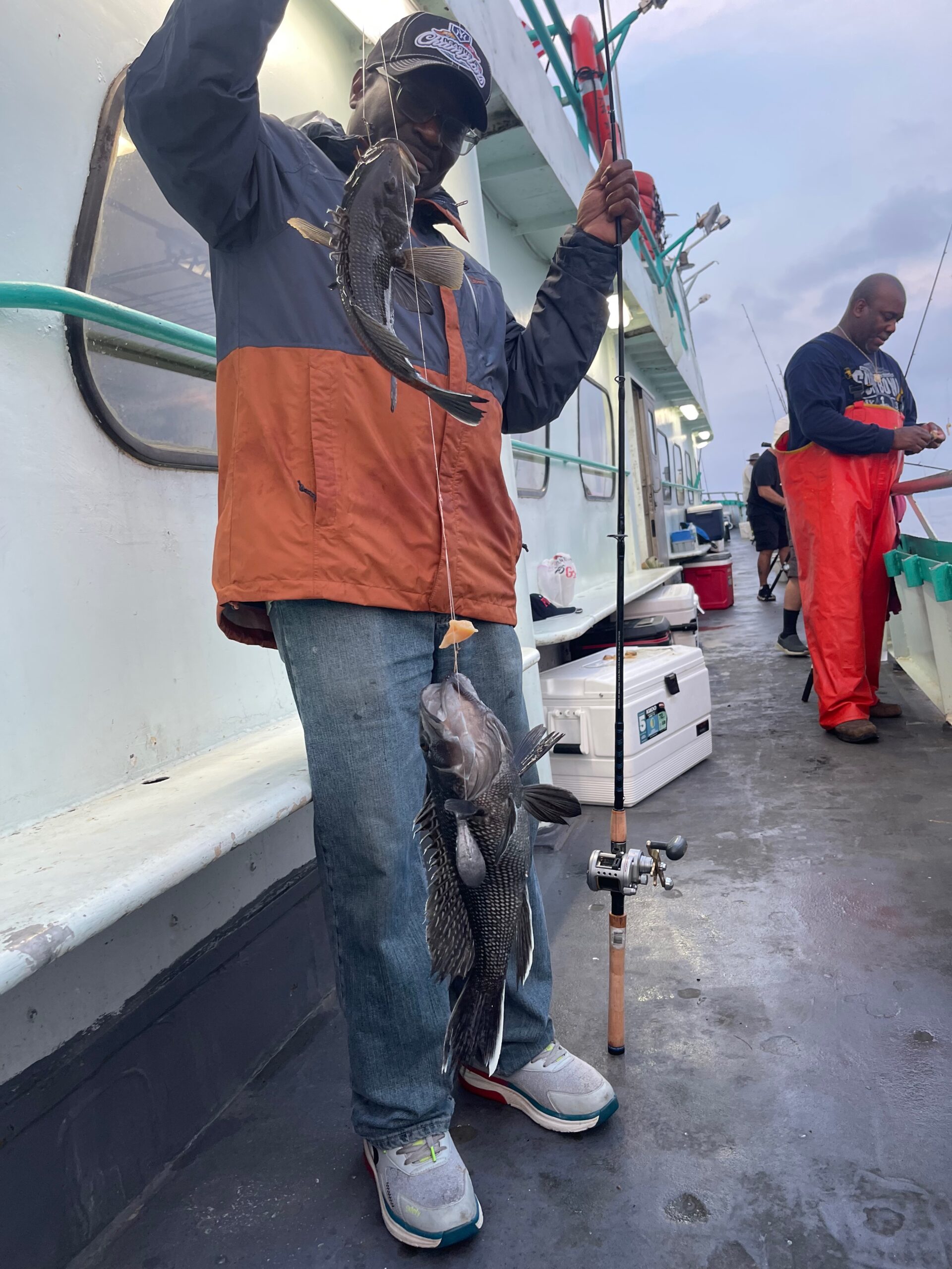 a group of people standing on top of a pole