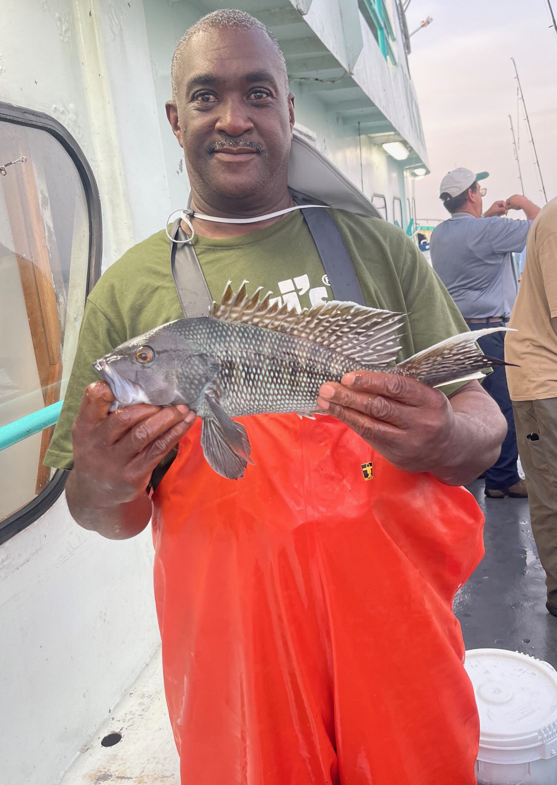 a man holding a fish
