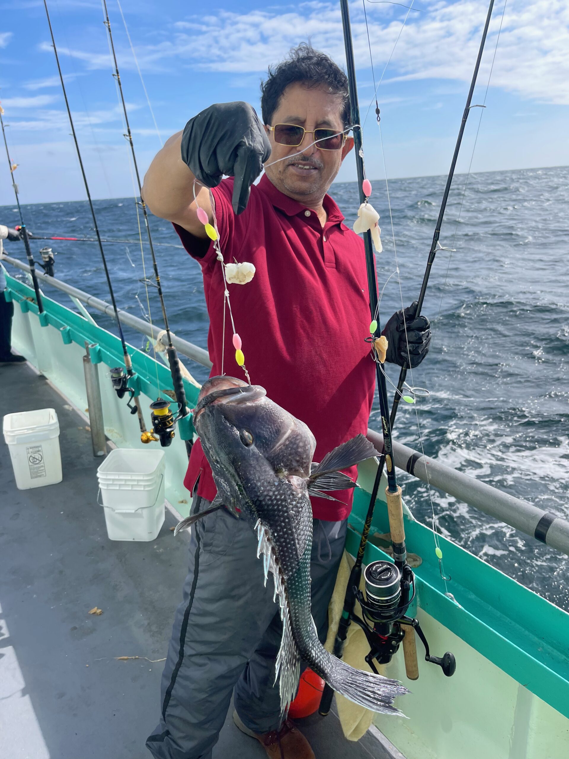 a person standing next to a body of water