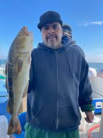 a man holding a fish