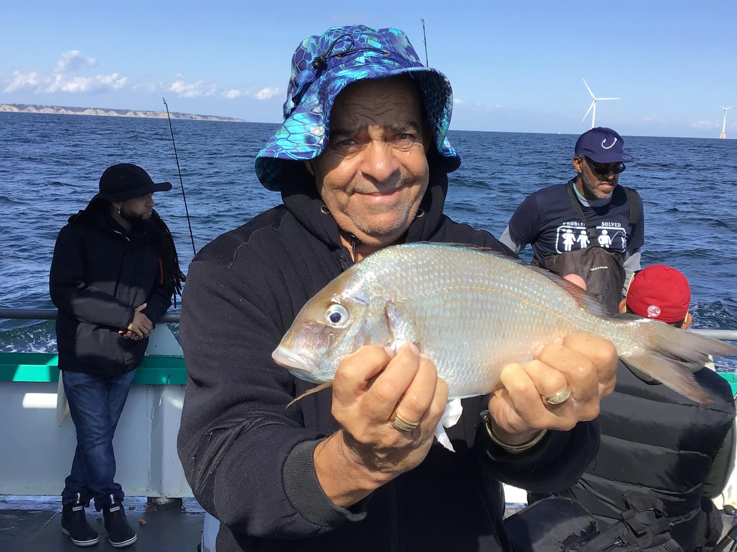 a person holding a fish in the water