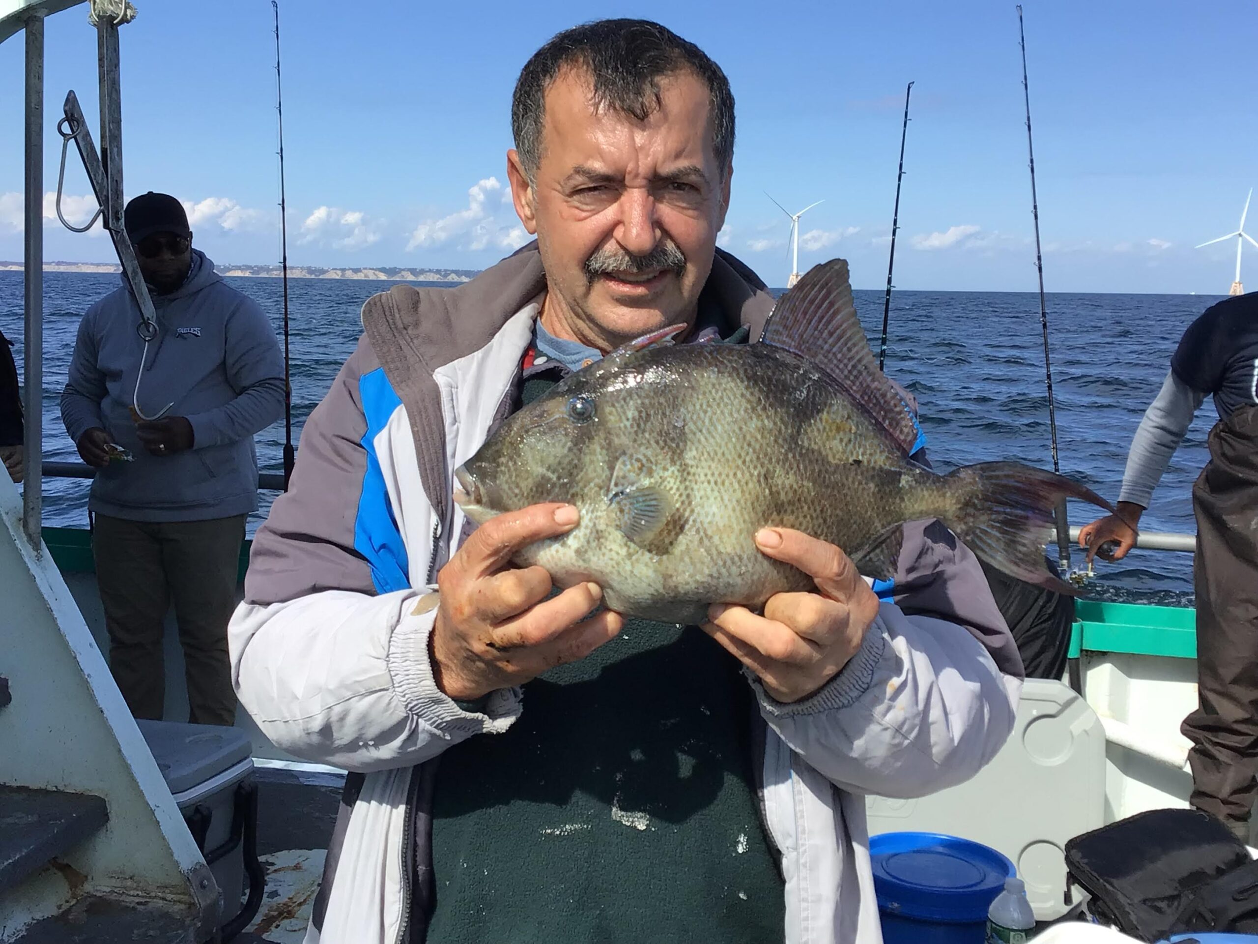 a person holding a fish in the water