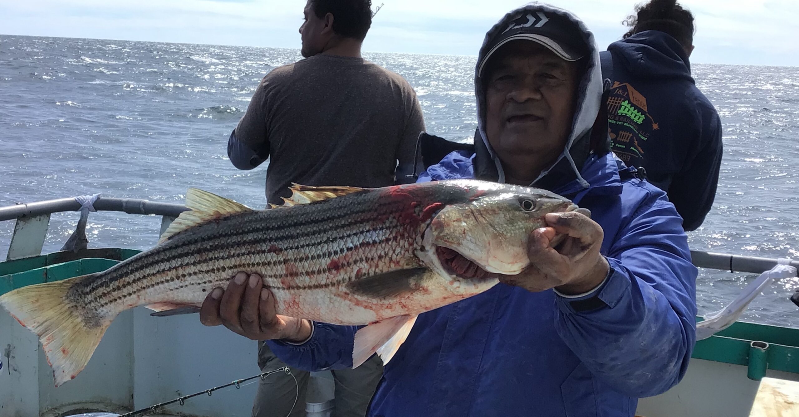 a person holding a fish in the water