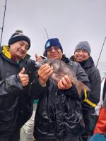 a person holding a fish