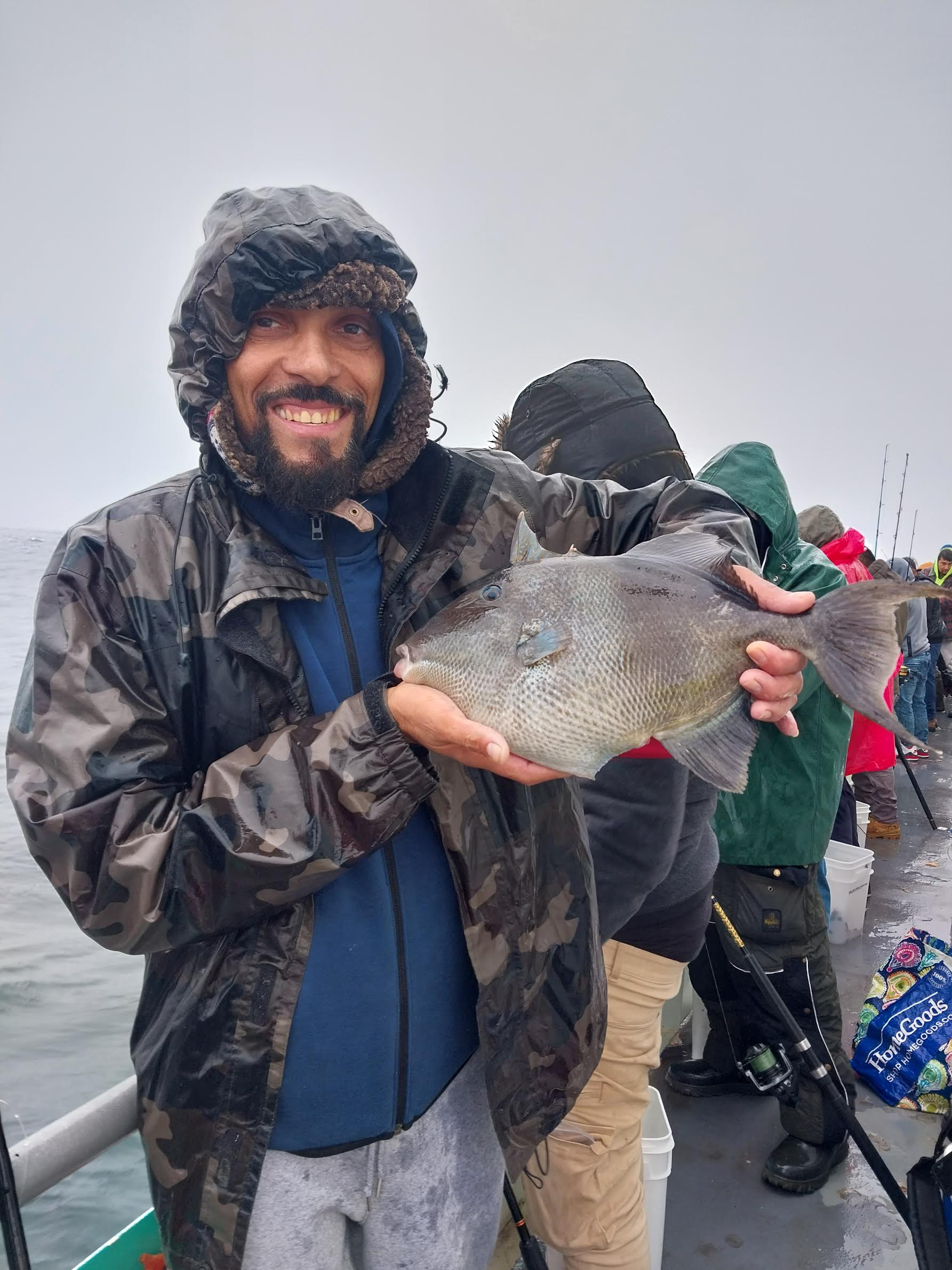 a man holding a fish